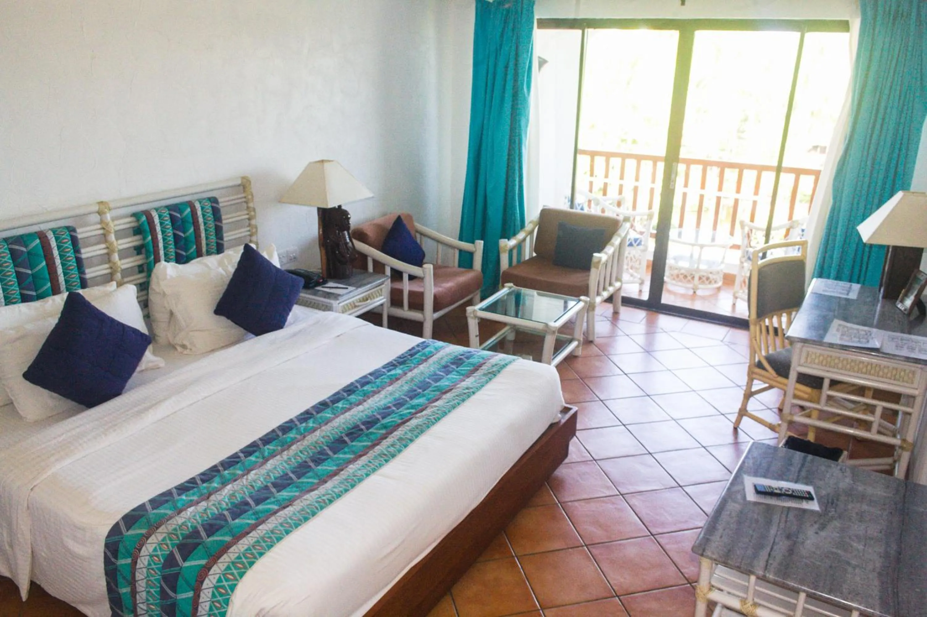Photo of the whole room, Bed in Diani Reef Beach Resort & Spa - Your Beachfront Bliss Awaits