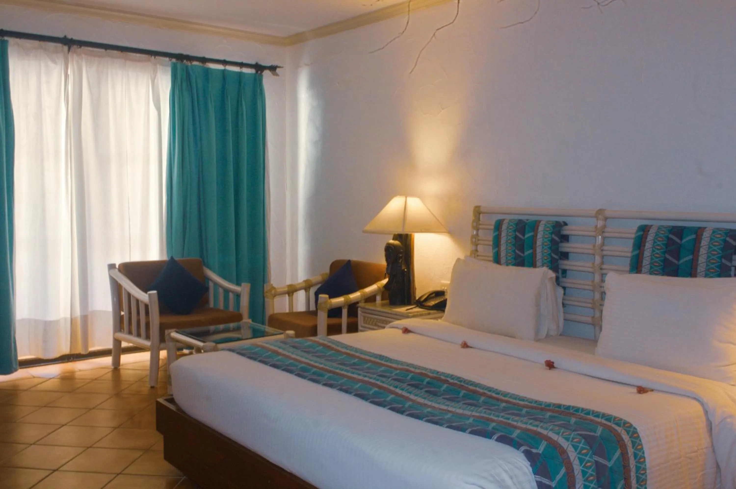 Bedroom, Bed in Diani Reef Beach Resort & Spa - Your Beachfront Bliss Awaits