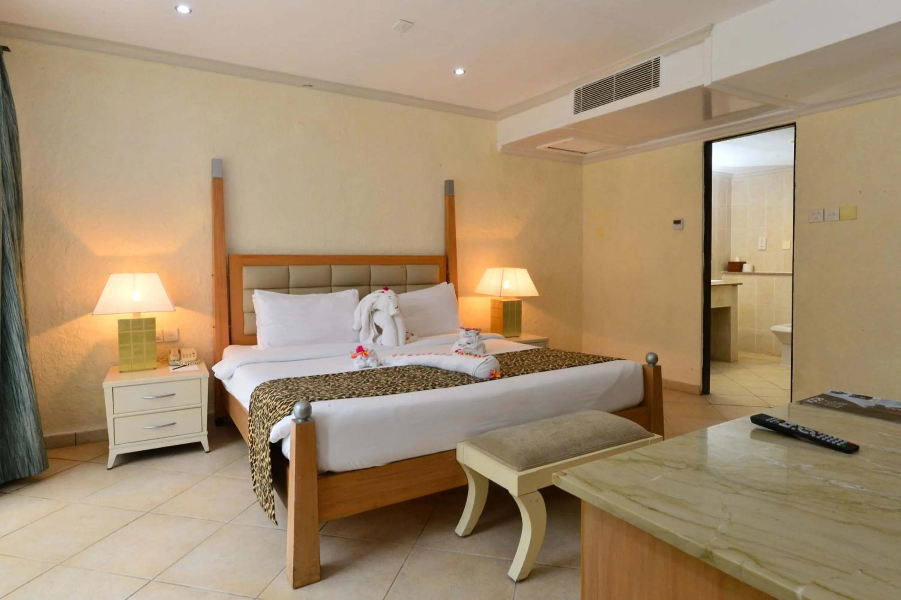 Bedroom, Bed in Diani Reef Beach Resort & Spa - Your Beachfront Bliss Awaits