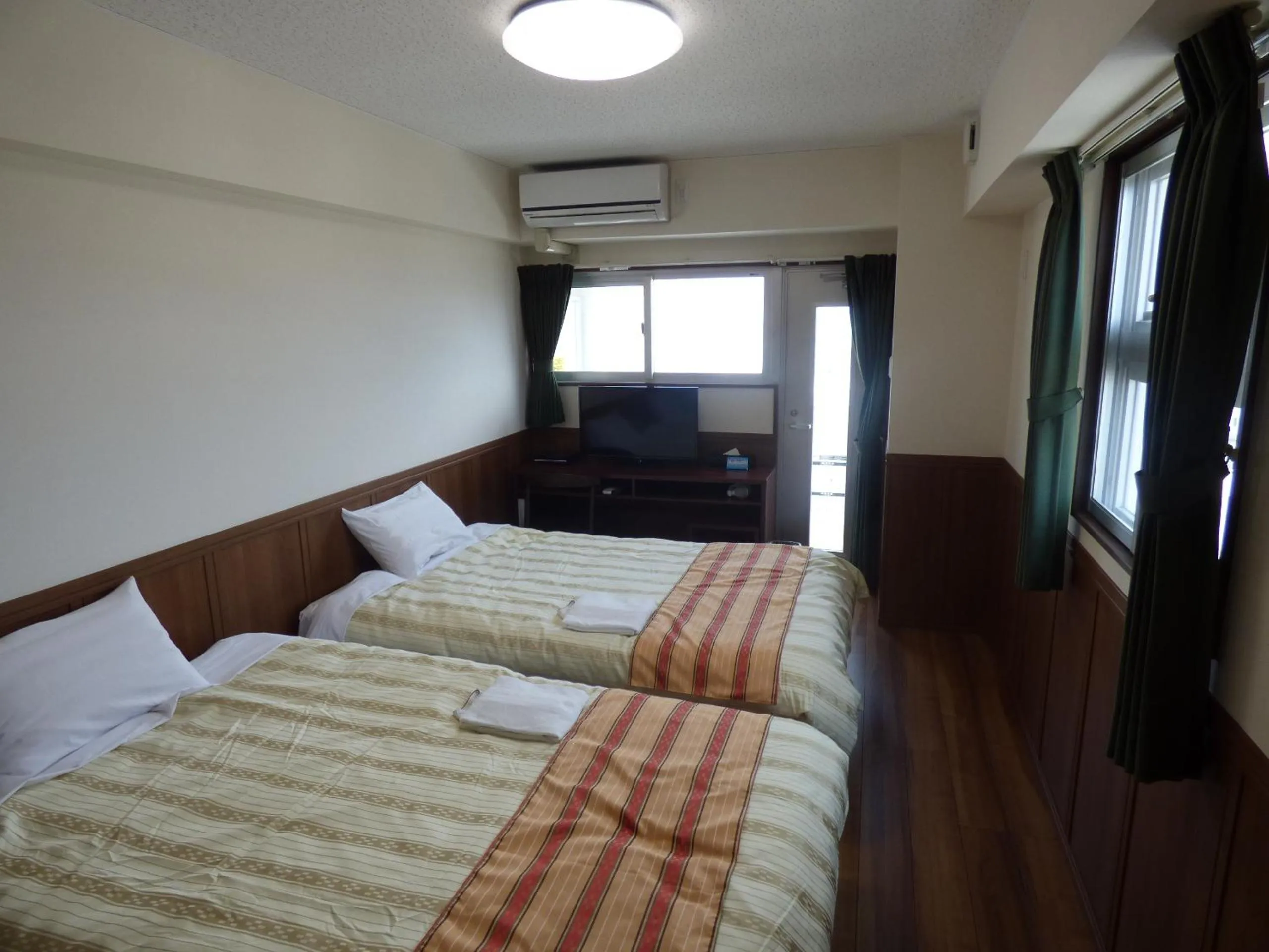 Bed in Hotel Peacely In Miyakojima Nexus