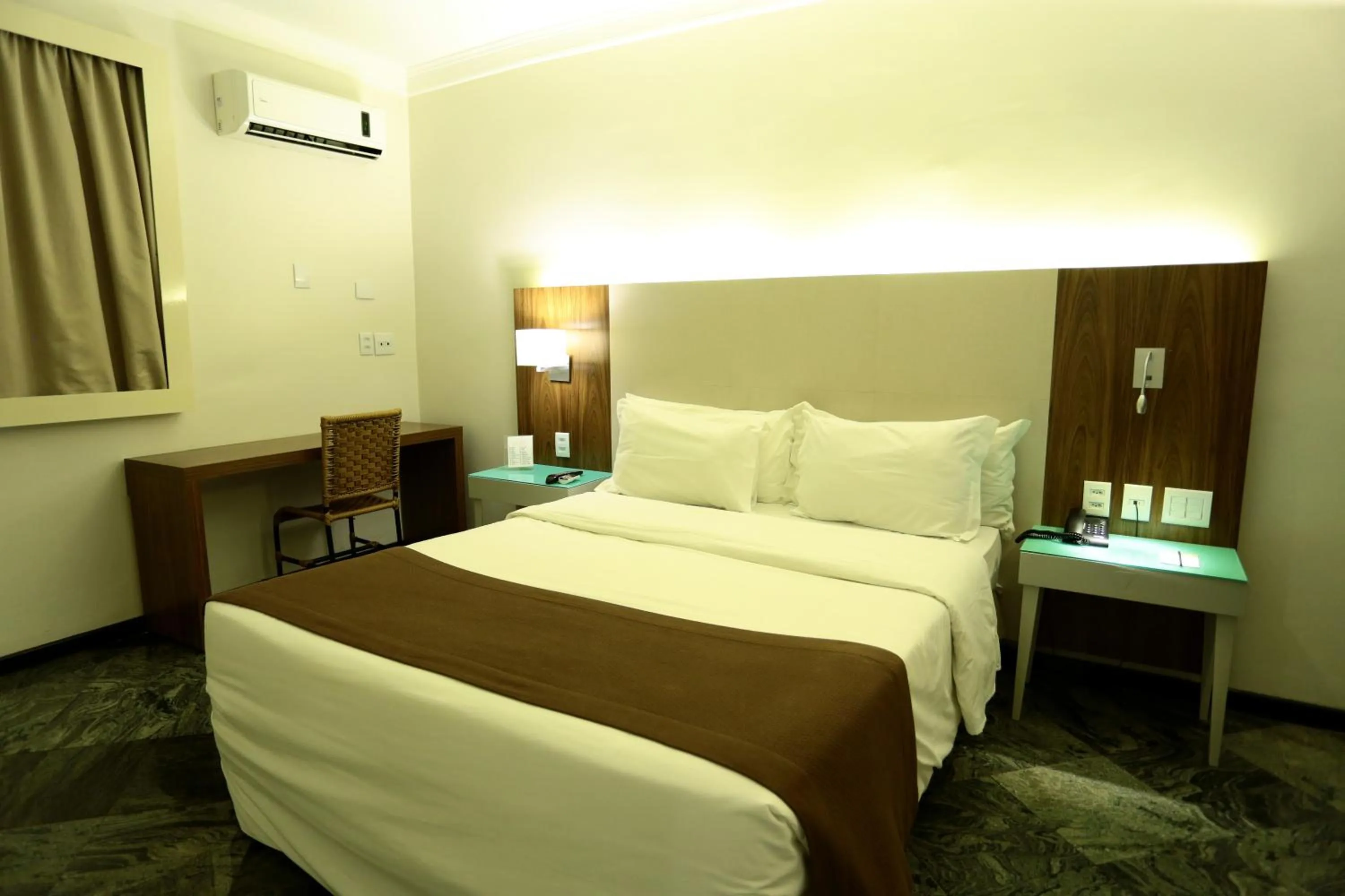 Bed in Oasis Plaza Hotel