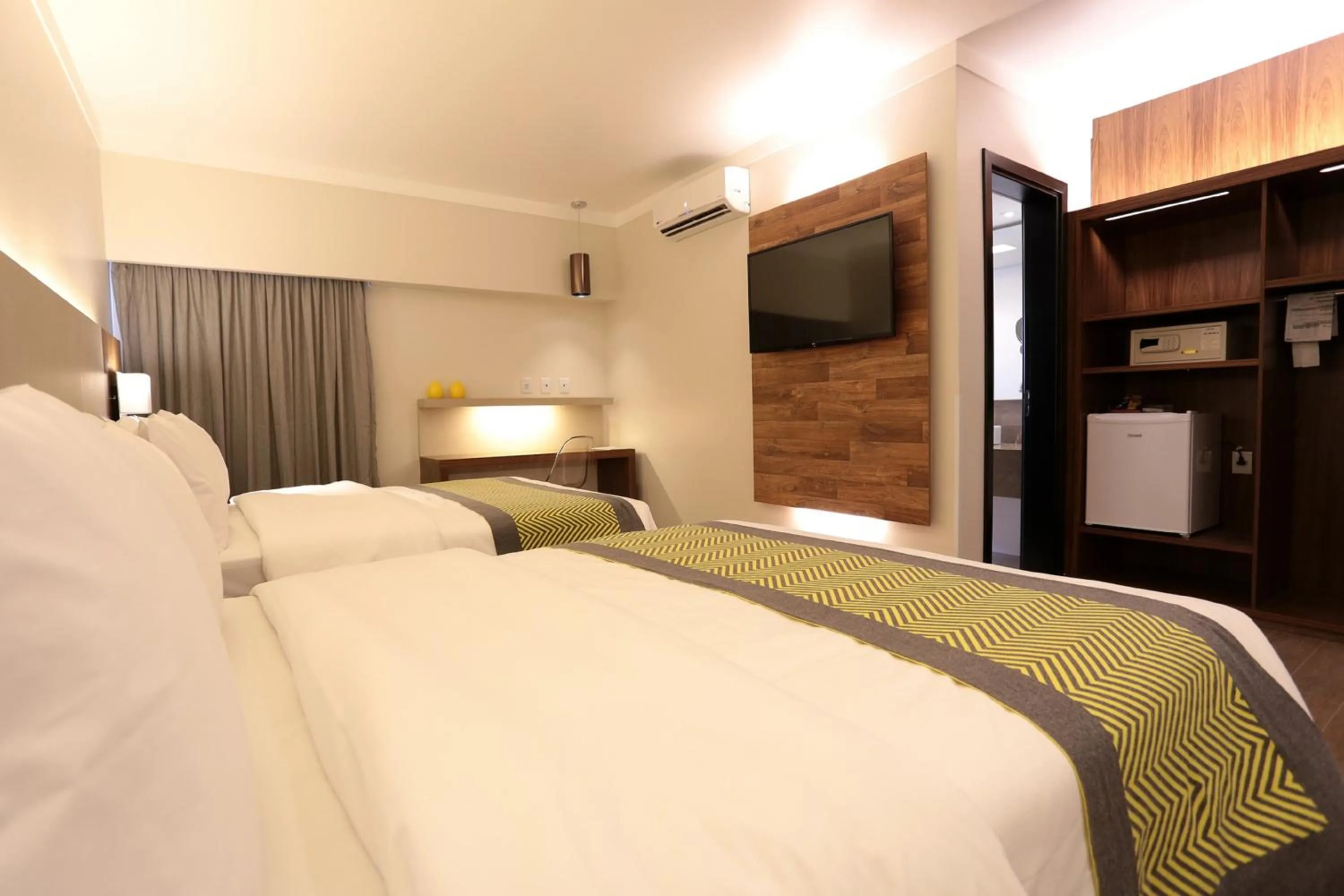 Bed in Oasis Plaza Hotel