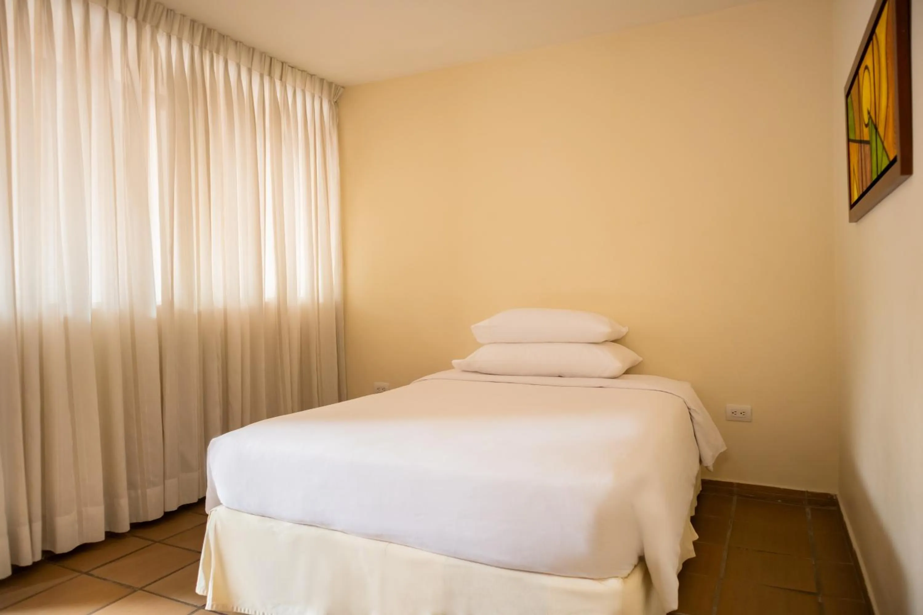 Bed in Hotel Faranda Bolivar Cucuta, a member of Radisson Individuals