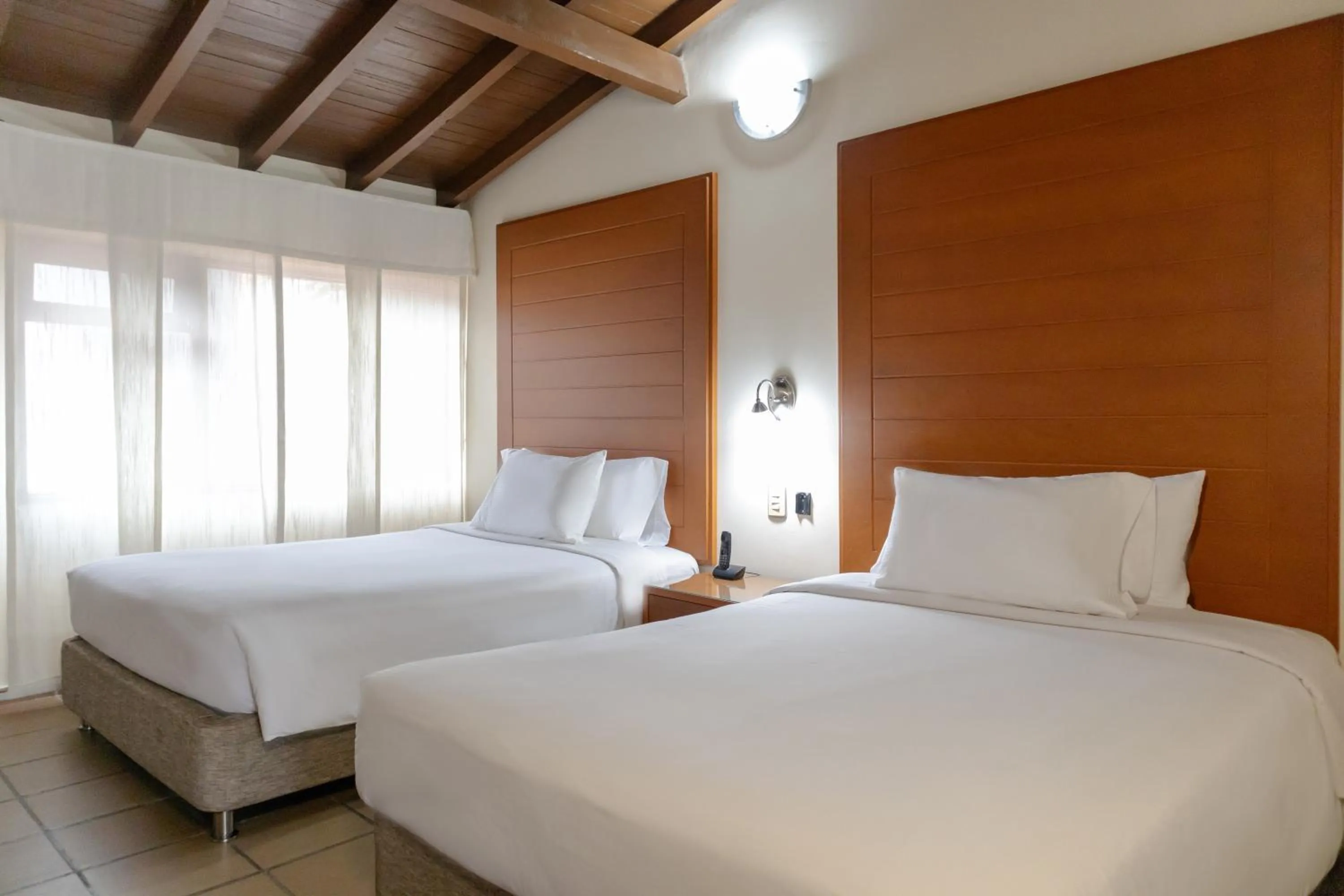 Bed in Hotel Faranda Bolivar Cucuta, a member of Radisson Individuals