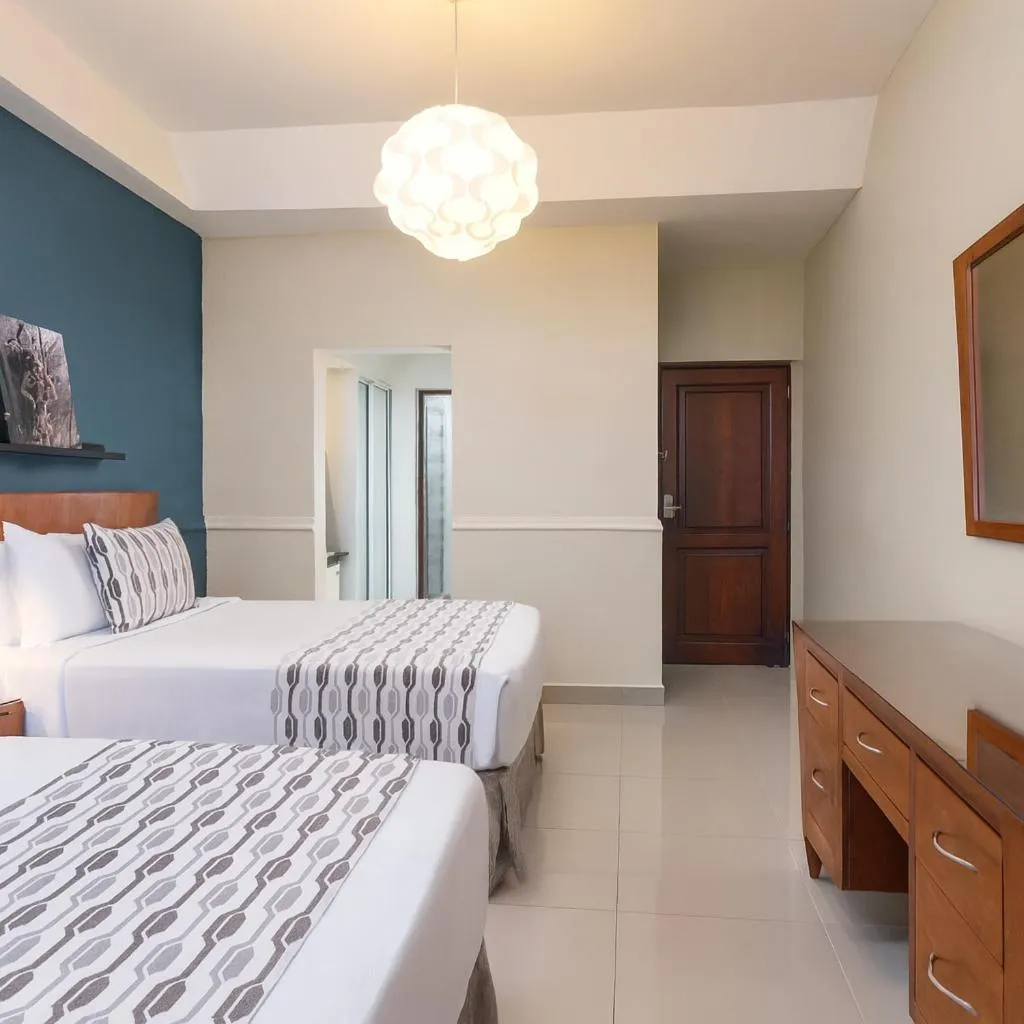 Bed in Hodelpa Caribe Colonial