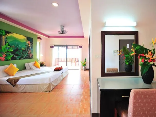 Bed in Koh Ngai Cliff Beach Resort