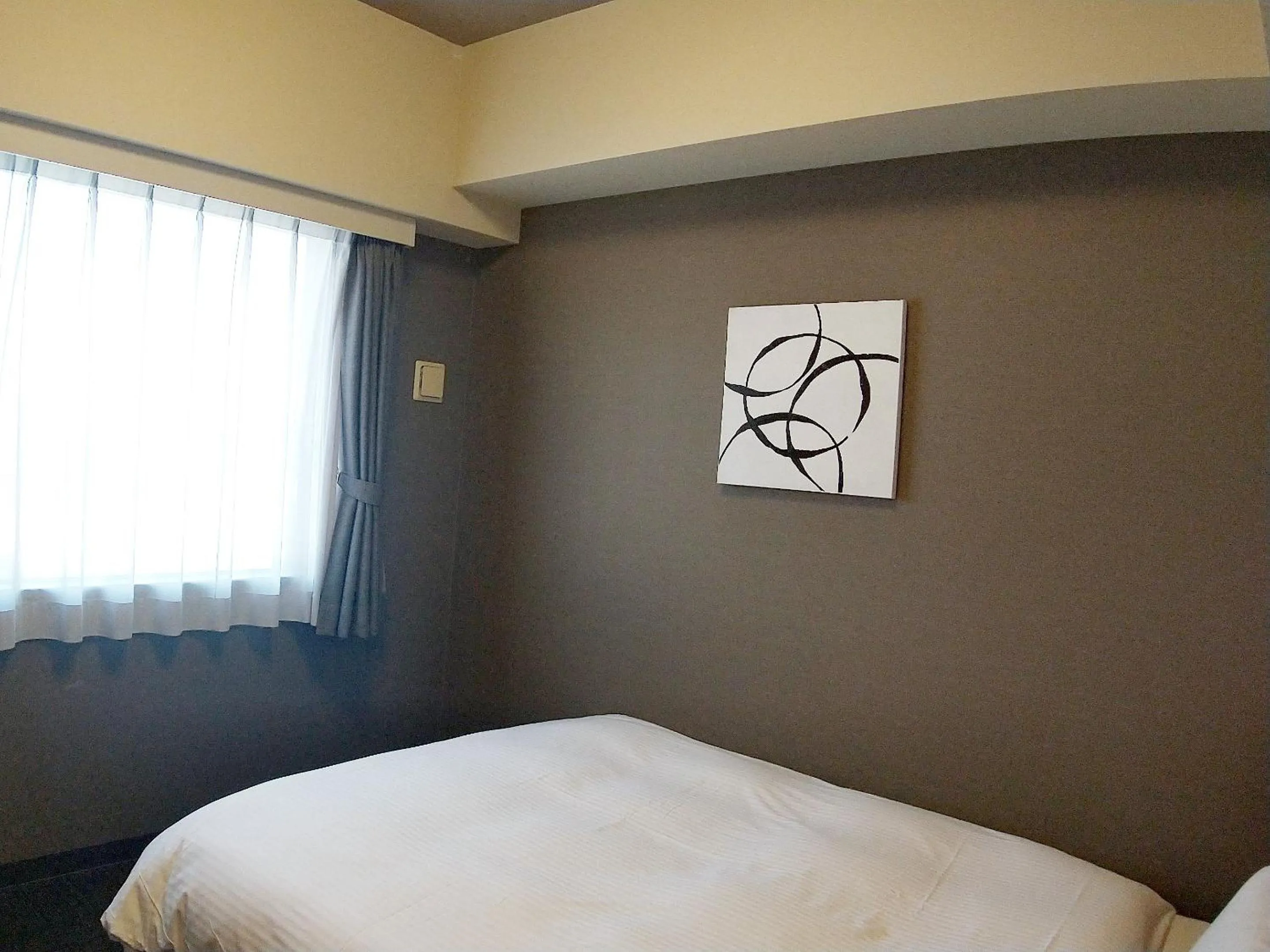 Photo of the whole room, Bed in Hotel Route-Inn Niigata Kencho-minami