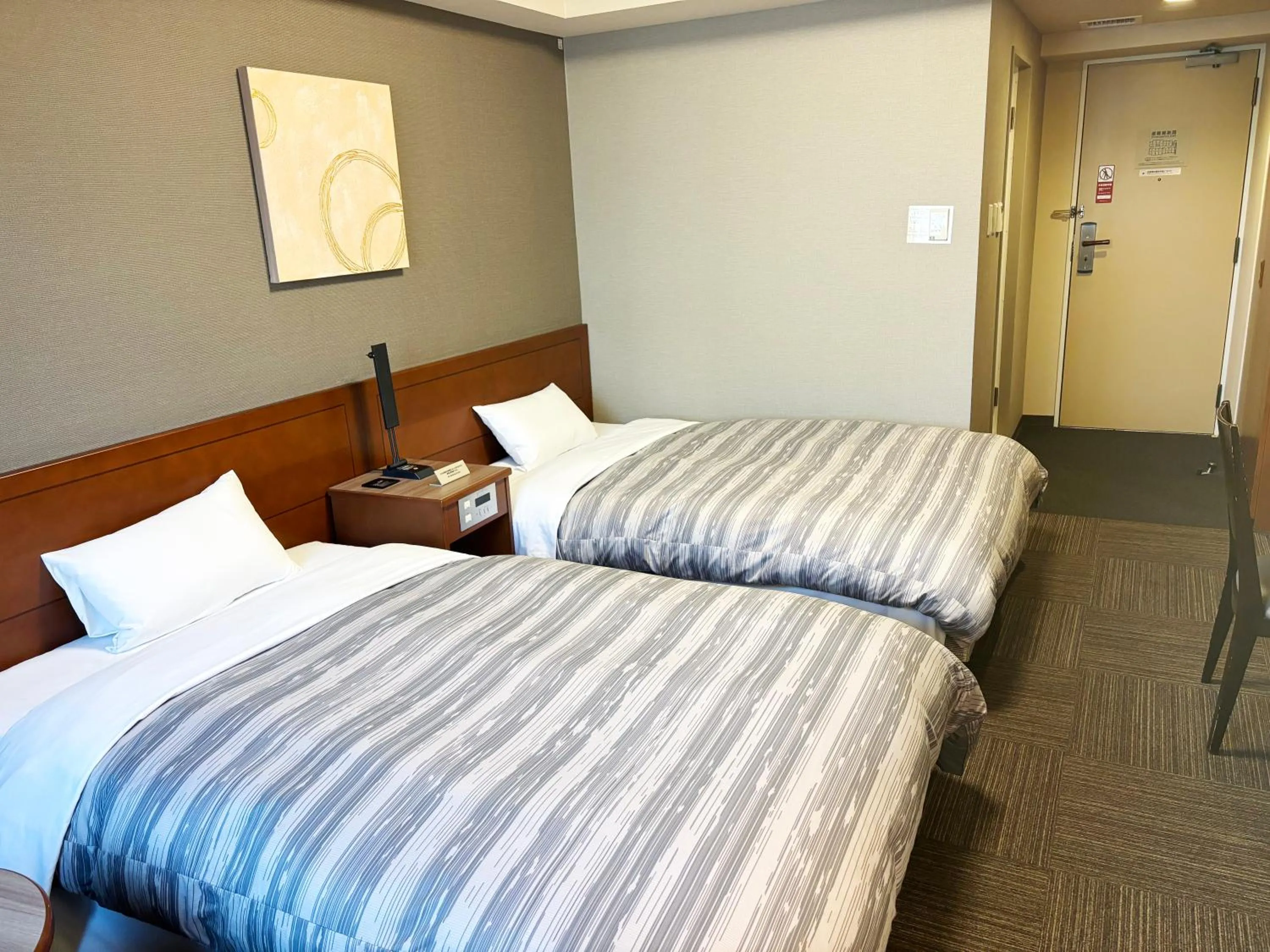 Photo of the whole room, Bed in Hotel Route-Inn Abashiri Ekimae