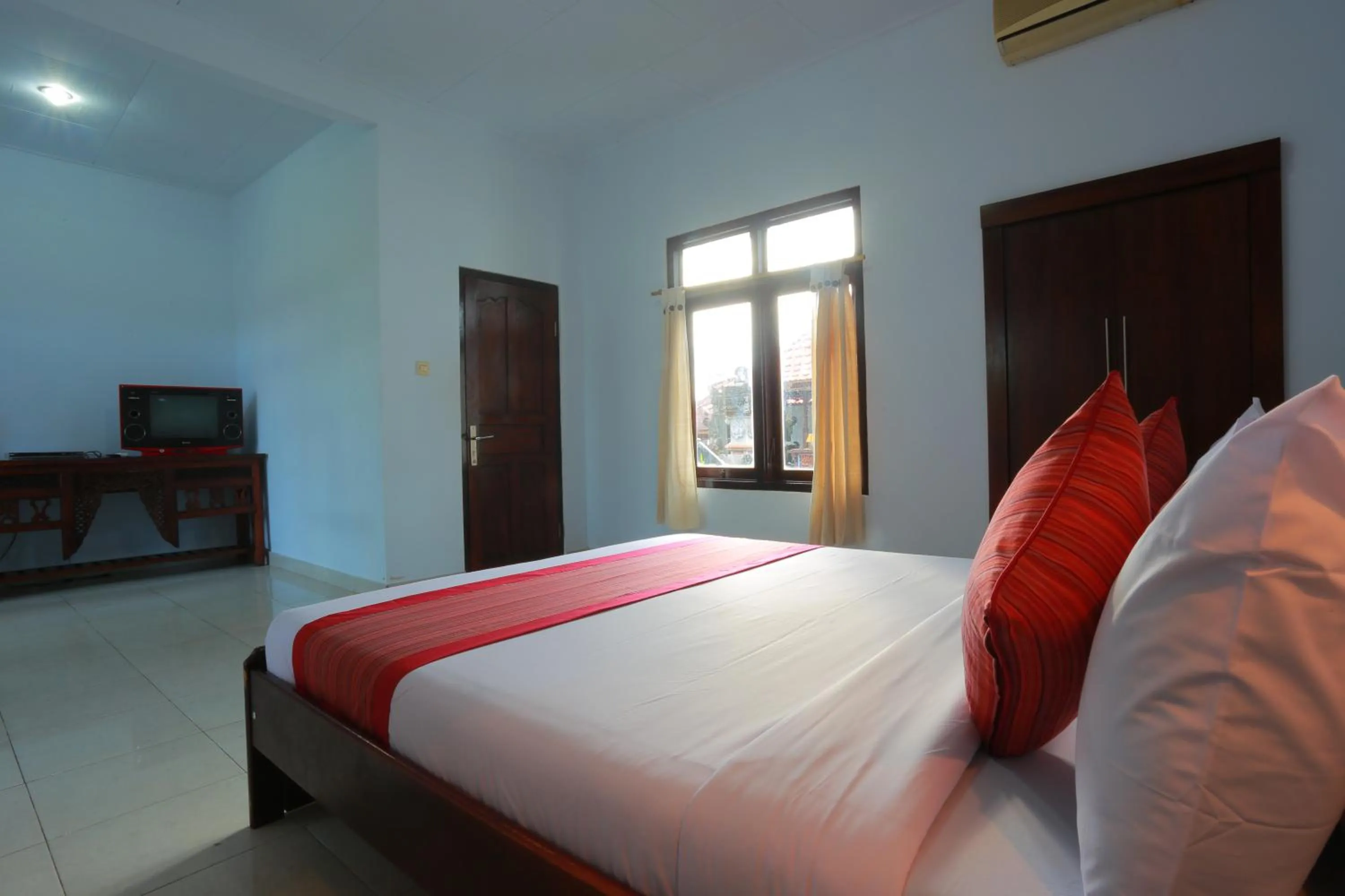 Communal lounge/ TV room, Bed in Warsa's Garden Bungalow and Spa