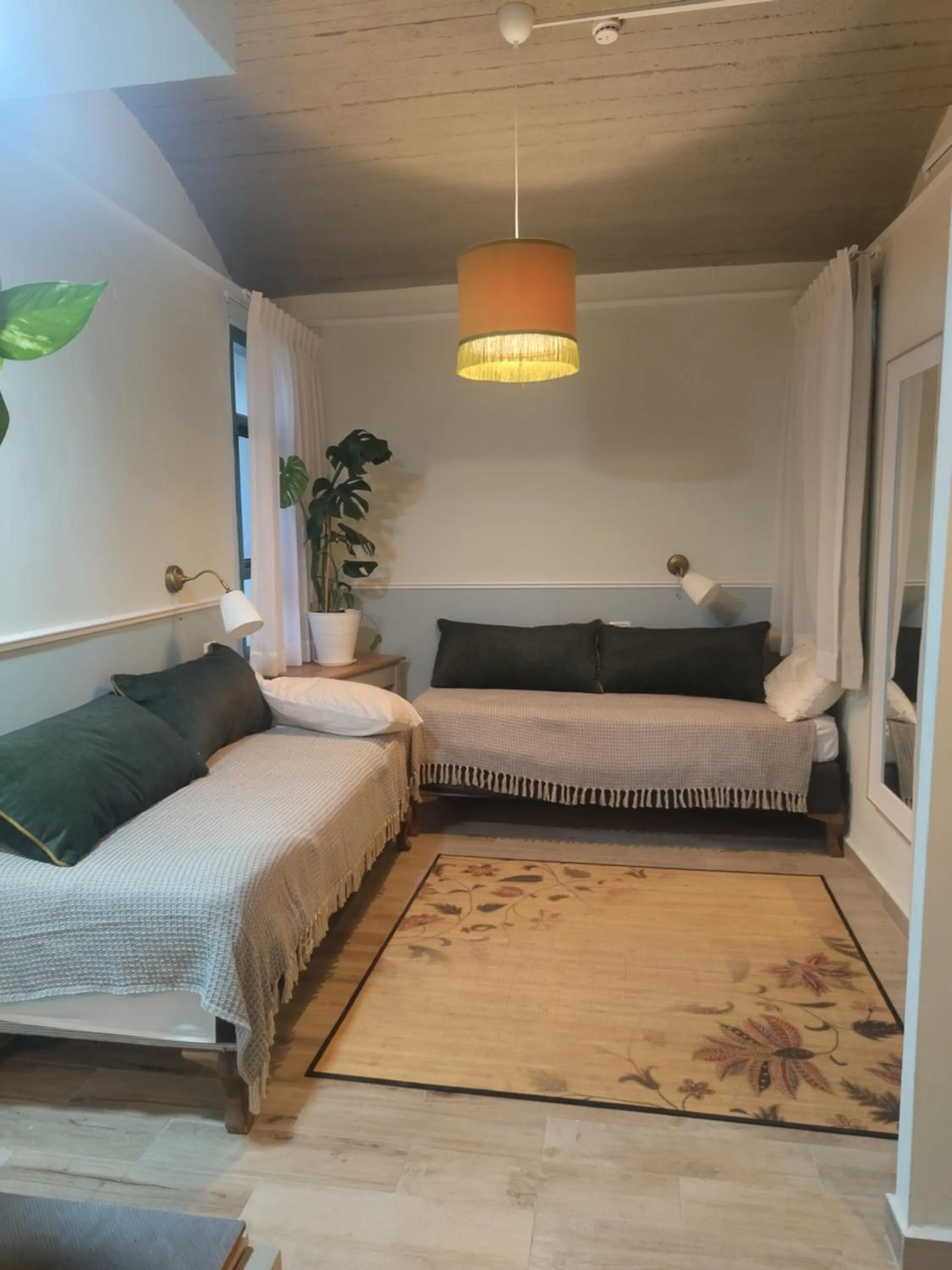 Living room, Bed in Neve Shalom Hotel