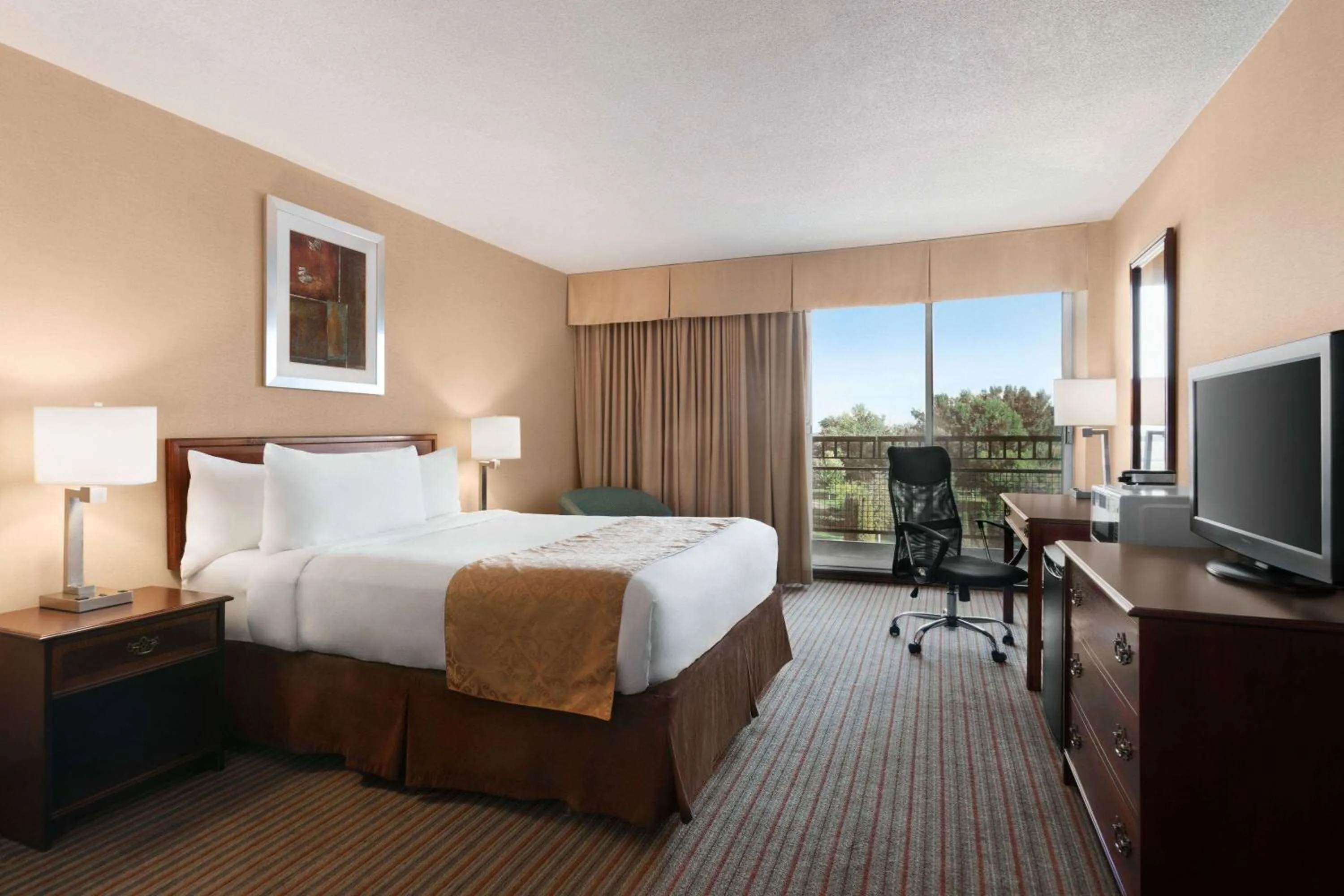 Photo of the whole room, Bed in Ramada by Wyndham Belleville Harbourview Conference Center