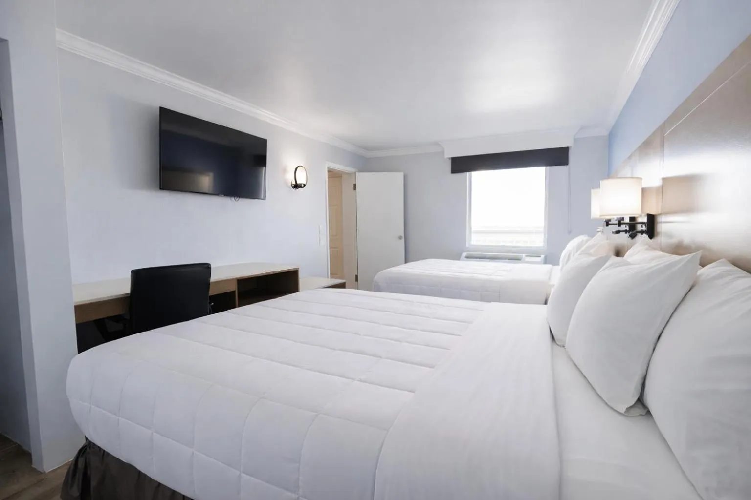 Bed in Destin Inn & Suites