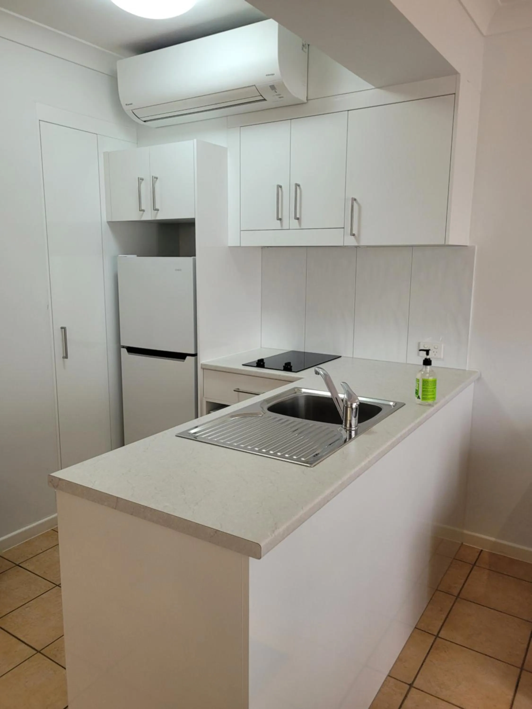 Kitchen or kitchenette in Port Douglas Apartments - Adults Only Oasis