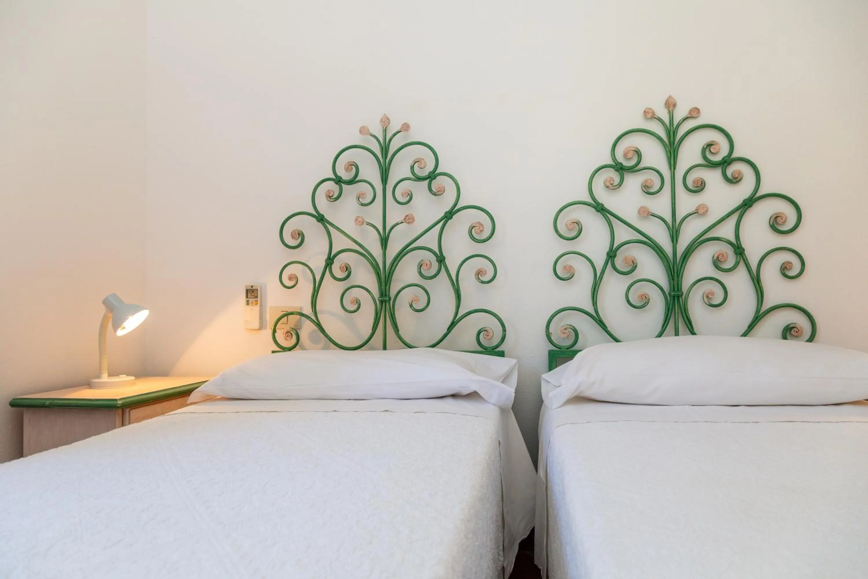 Bed in Hotel Piccolo Pevero