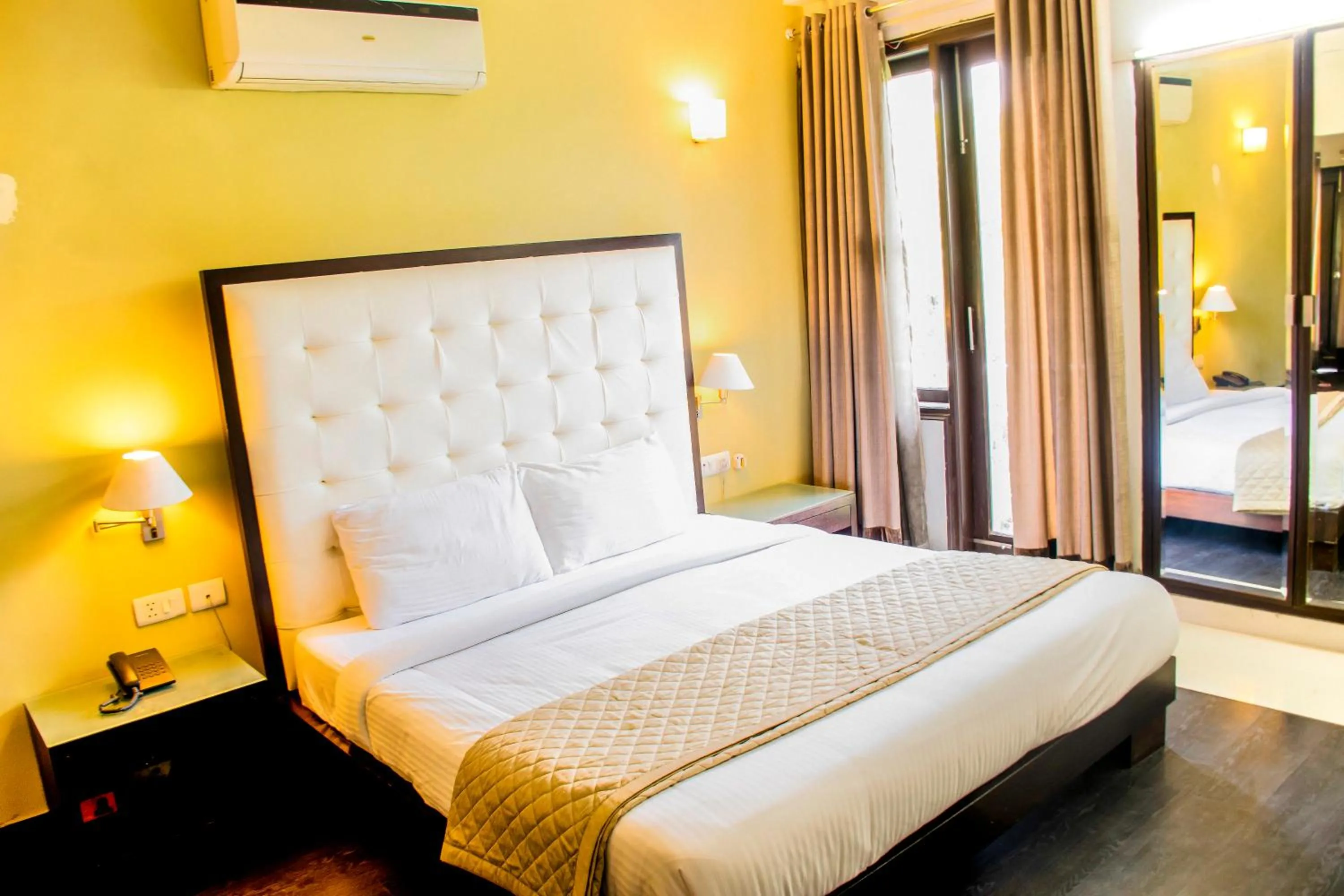 Bed in FabHotel Anutham Saket