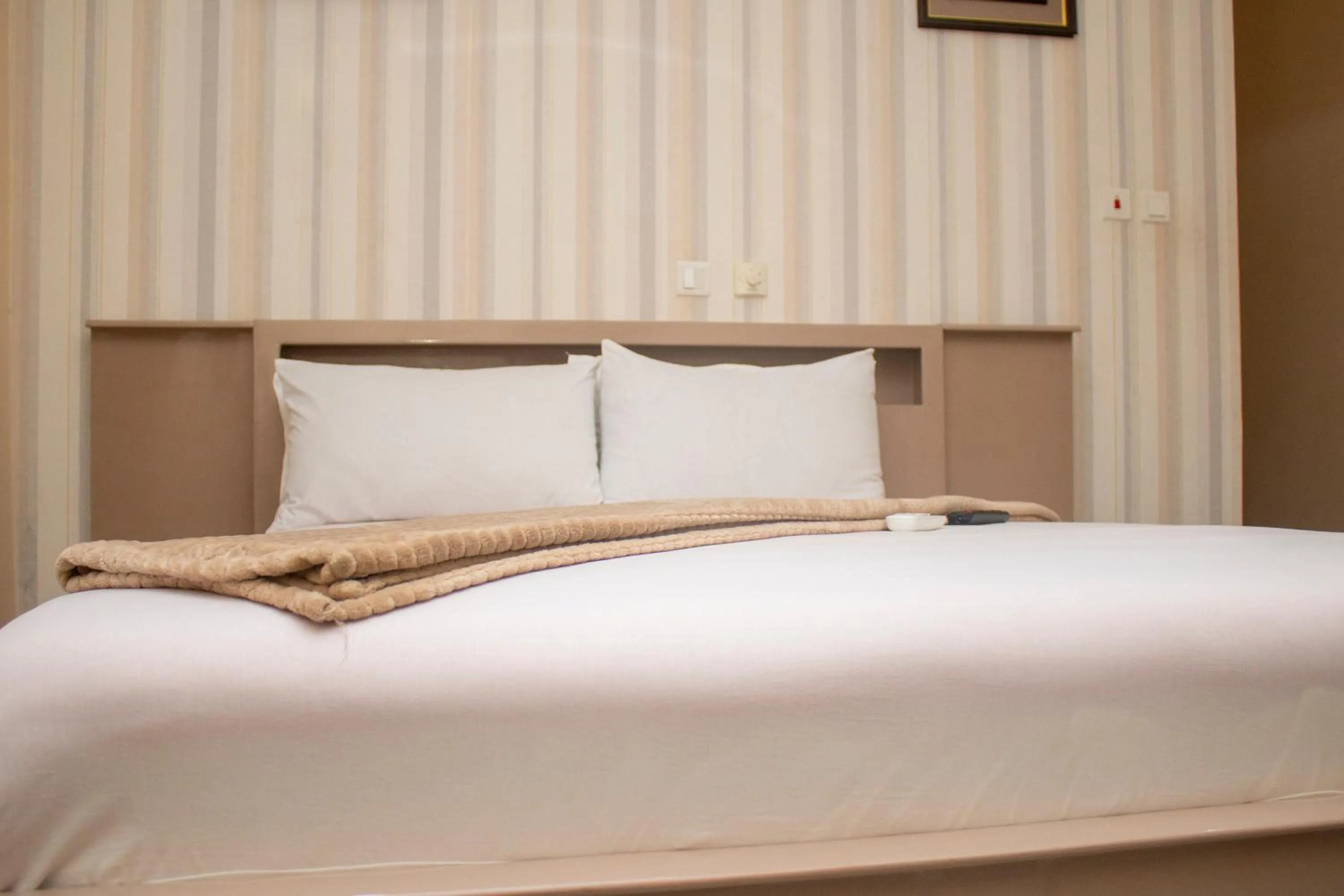 Bed in Exotic Palace Hotel