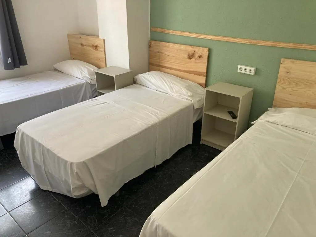 Bed in Malvarrosa Beach Rooms