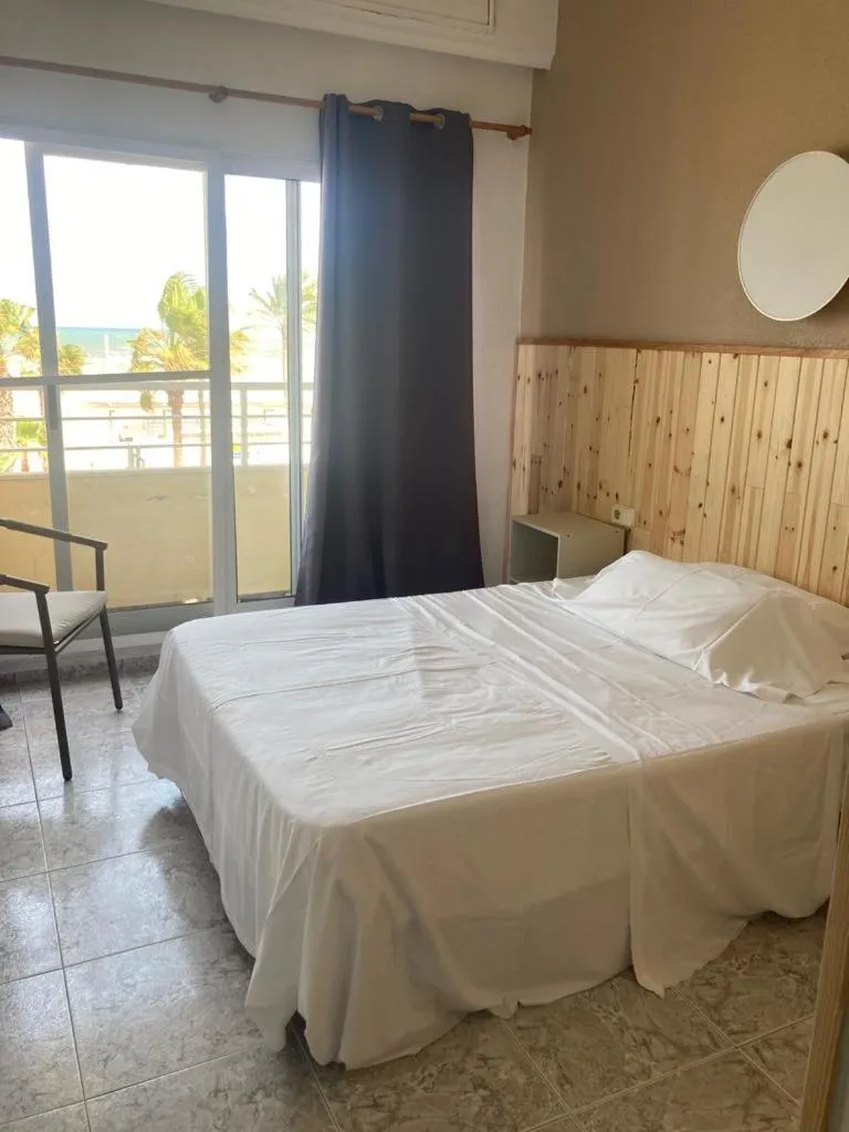 Bed in Malvarrosa Beach Rooms