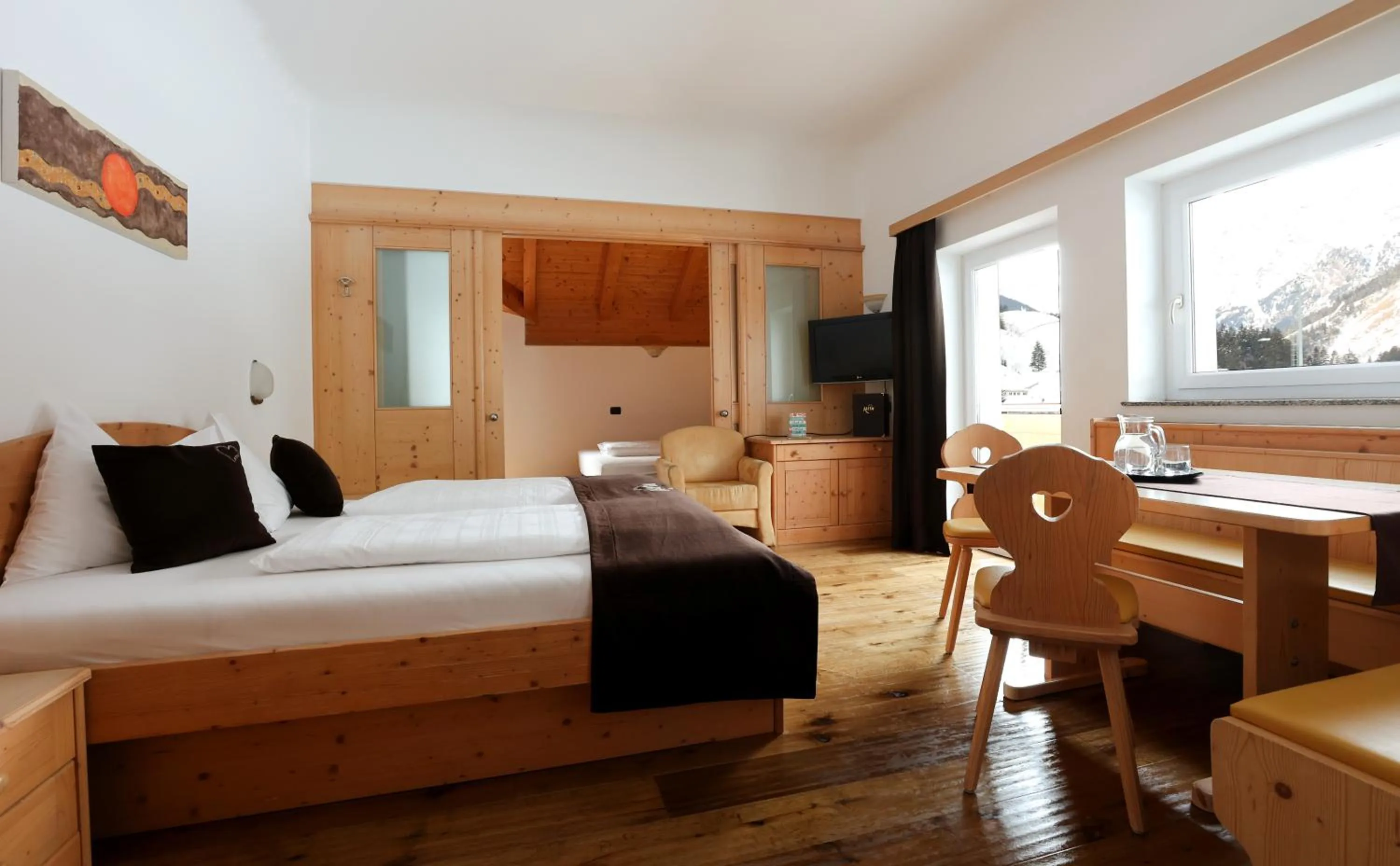 Seating area, Bed in Hotel Alpin