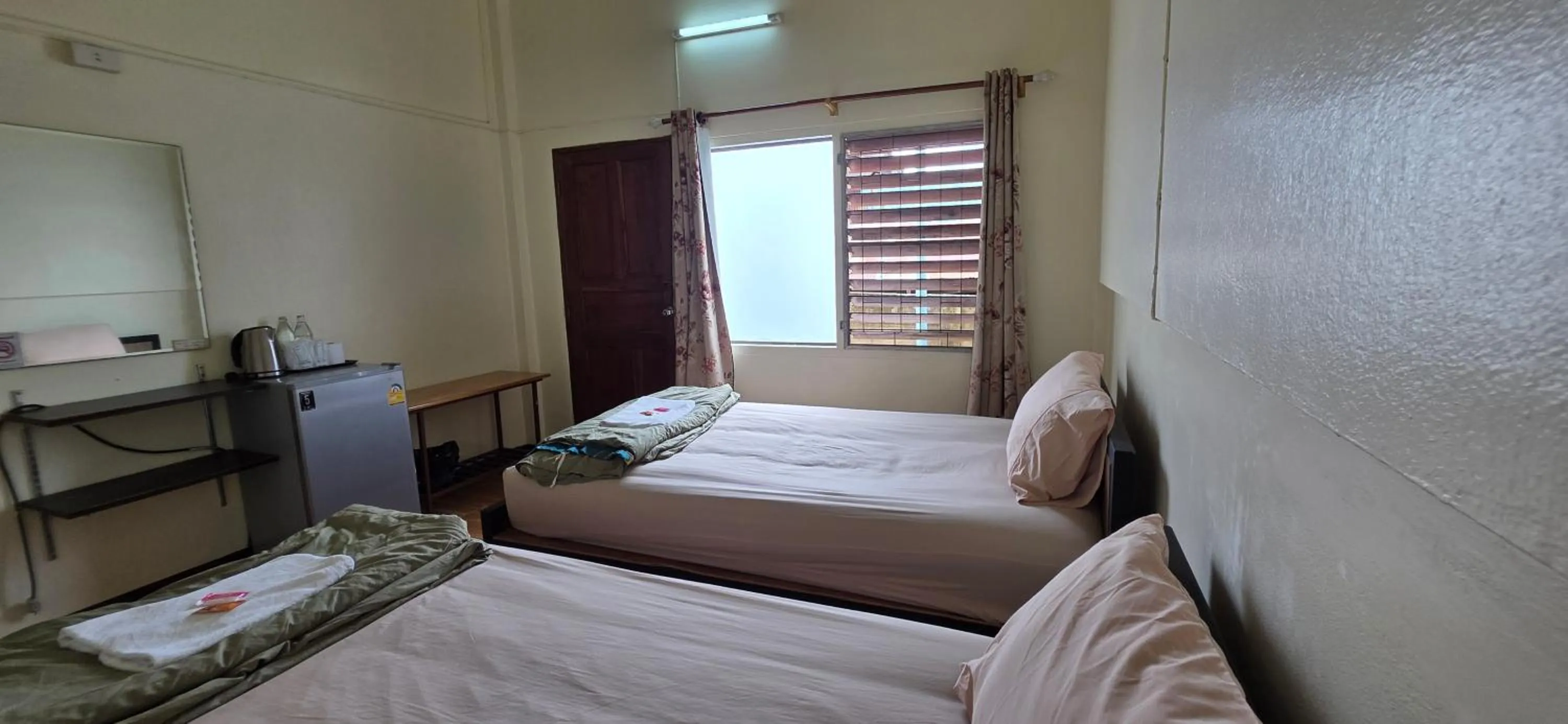 Photo of the whole room, Bed in P.L.P Guesthouse - Mae Hong Son