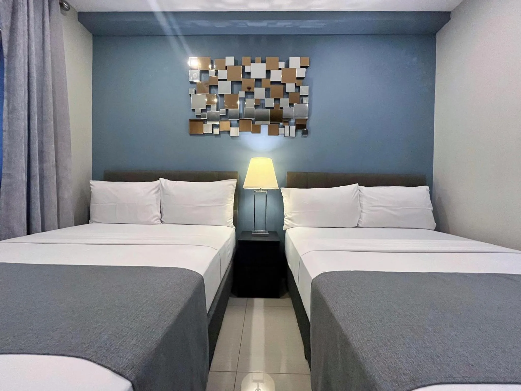 Bedroom, Bed in Artemis Place Makati Hotel