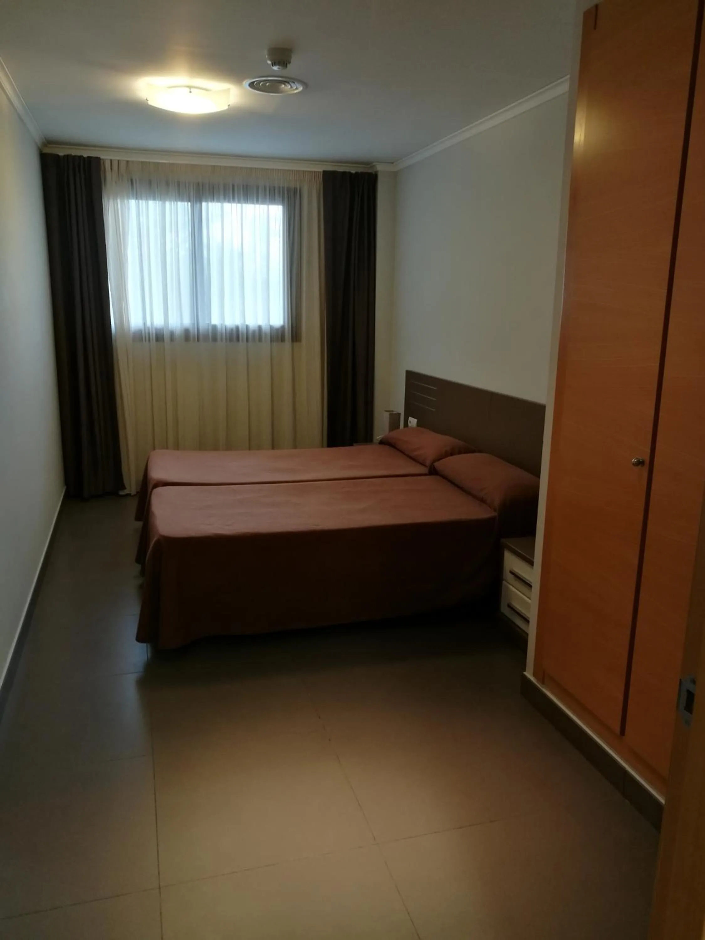 Bed in Aparthotel El Faro