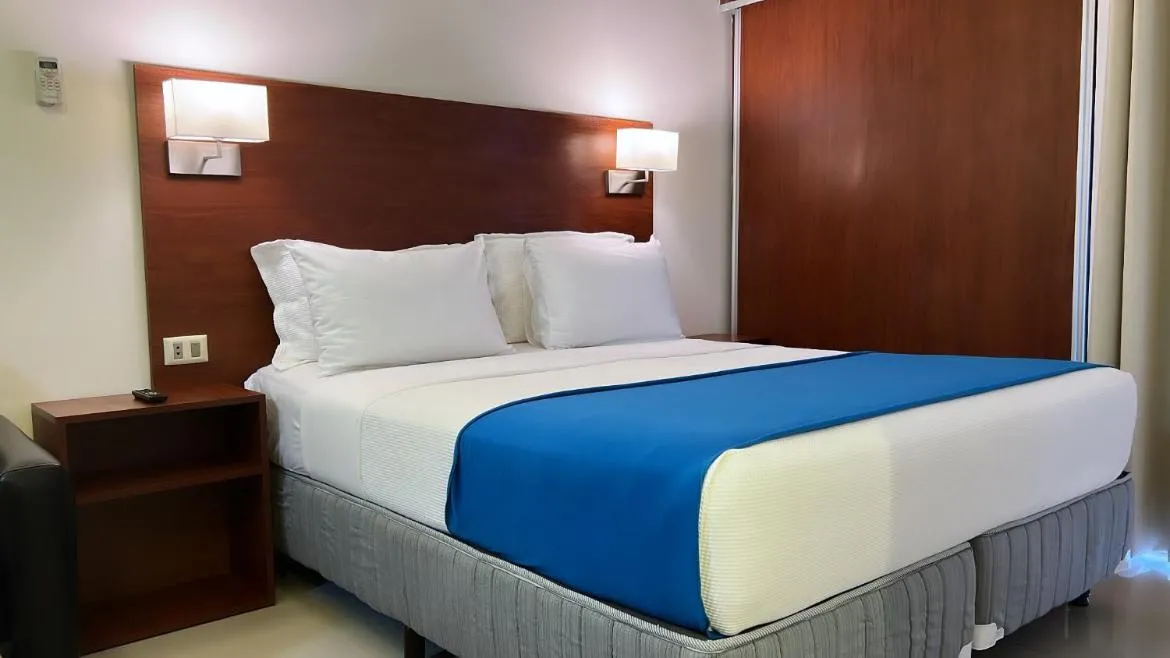Bed in Pacifico Apart Hotel