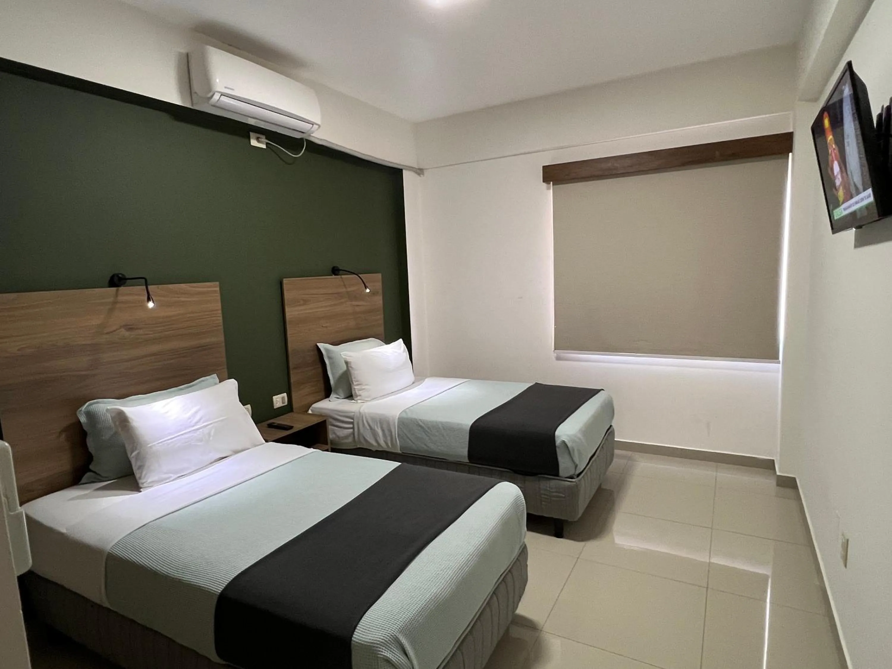 Bed in Pacifico Apart Hotel