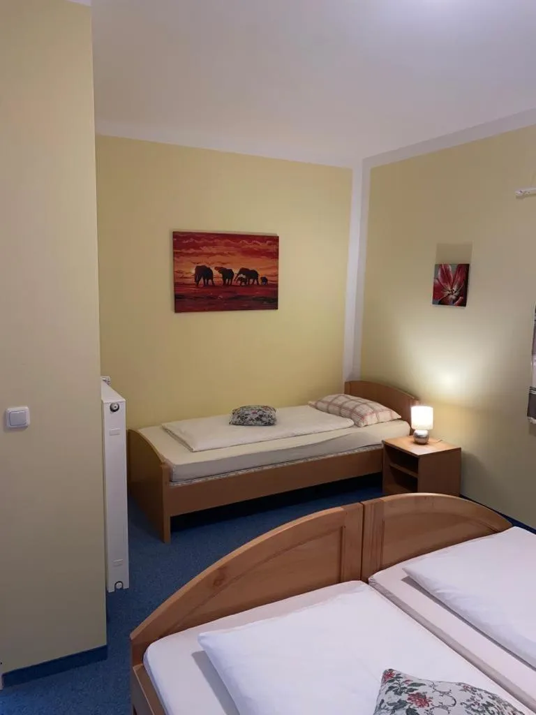 Bed in Garni Hotel Post