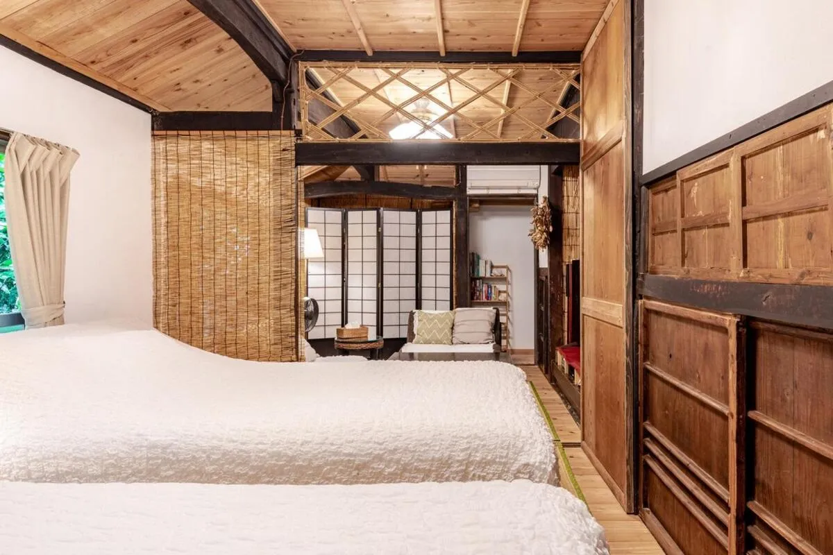 Living room, Bed in #Nerome01 Traditional Okinawan House in Ogimi, bc
