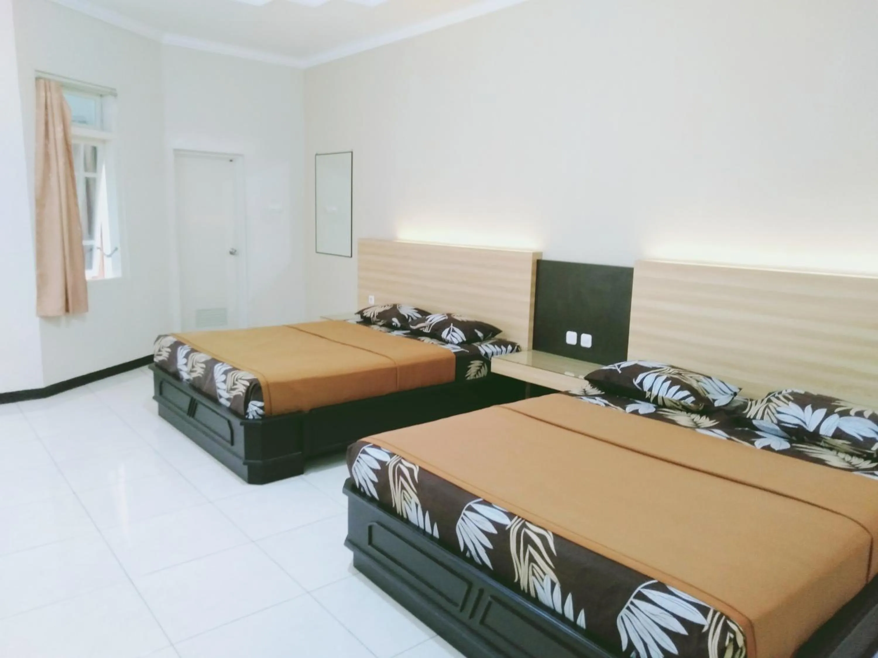 Bed in Hotel Taman Indah