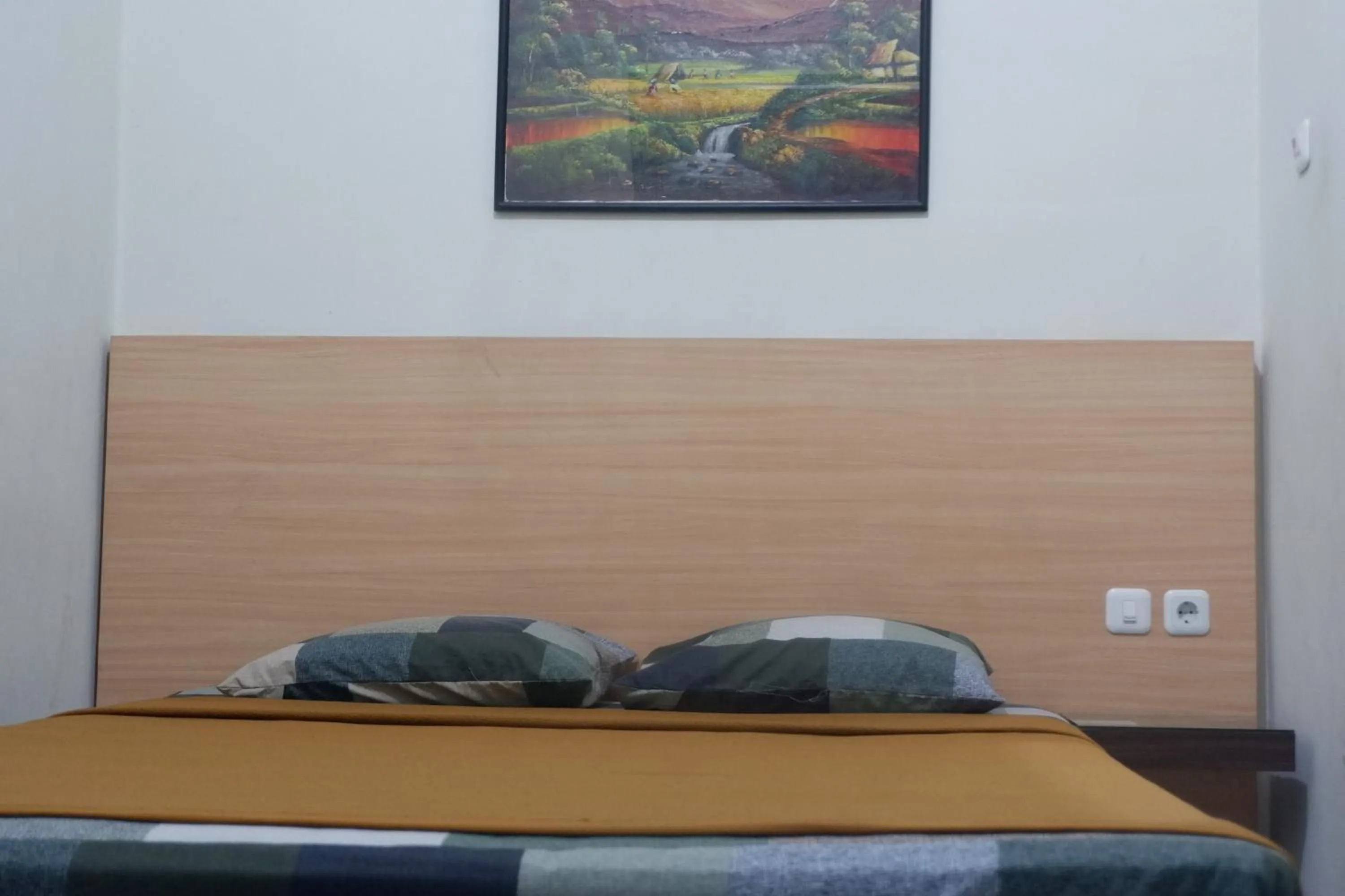 Bed in Hotel Taman Indah