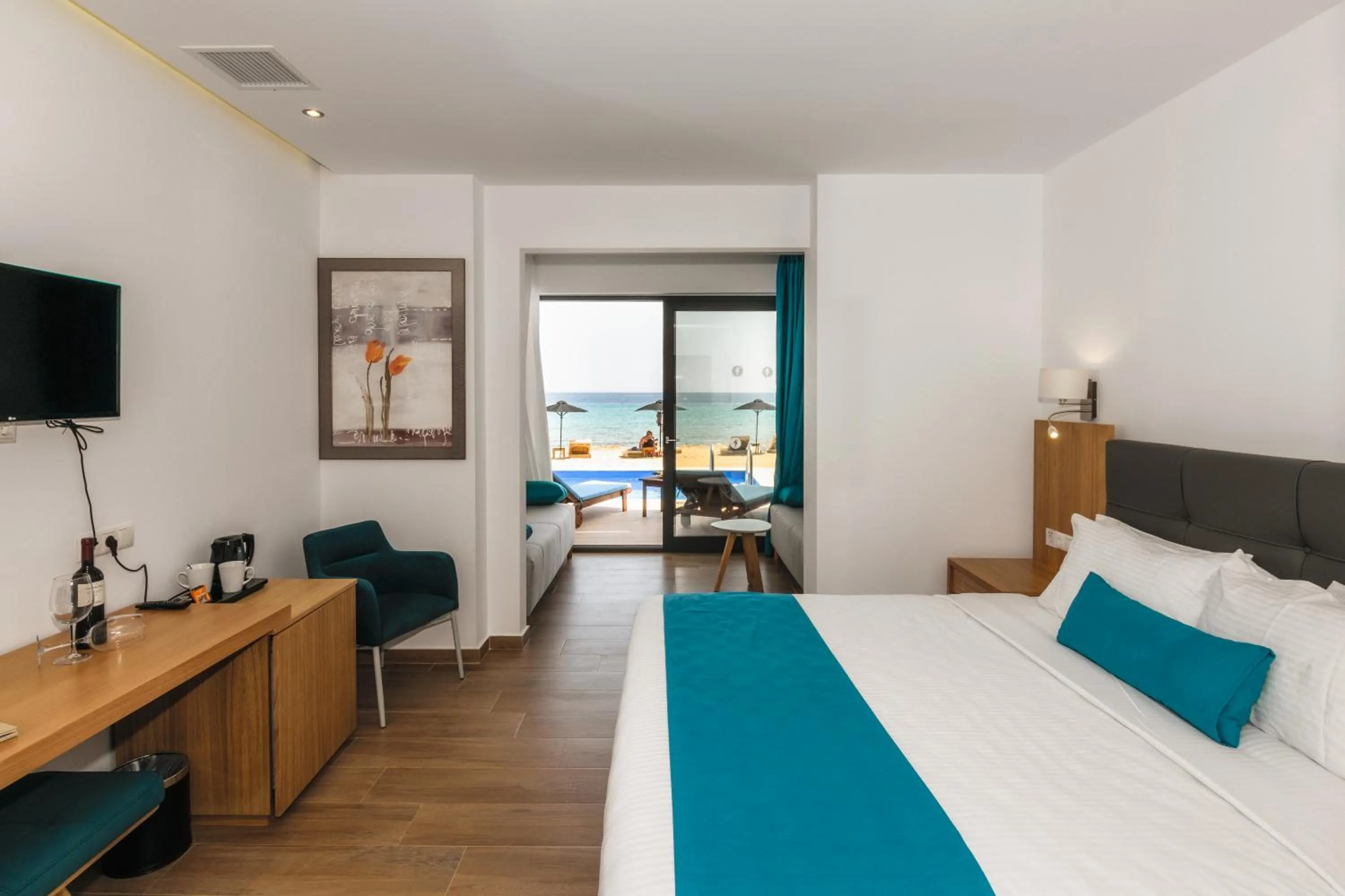 Photo of the whole room, Bed in Cavo Orient Beach Hotel & Suites