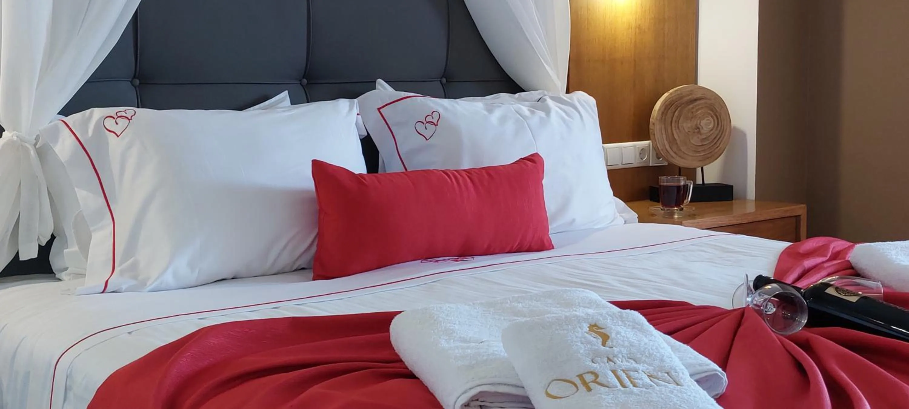Bed in Cavo Orient Beach Hotel & Suites
