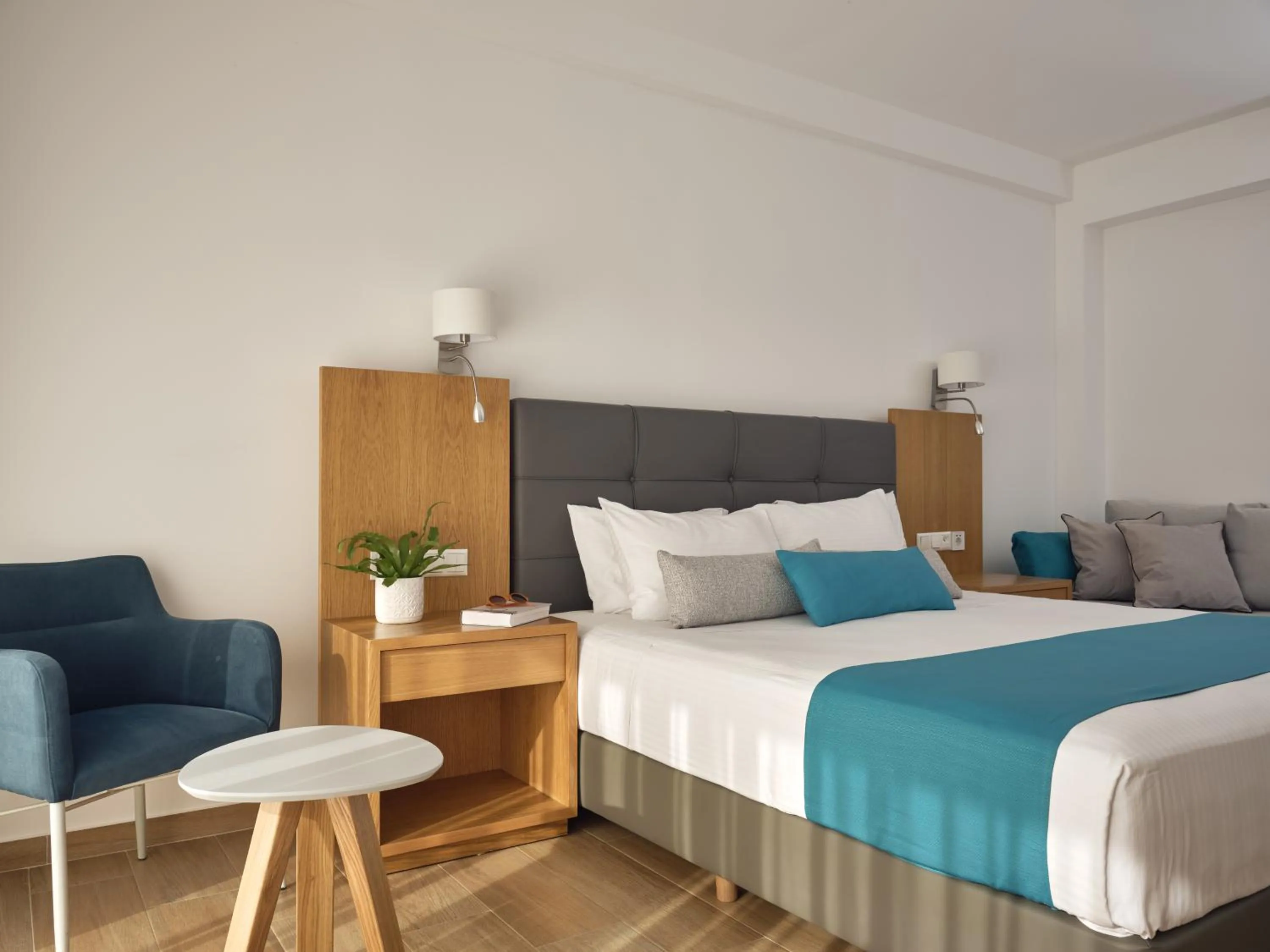 Bedroom, Bed in Cavo Orient Beach Hotel & Suites