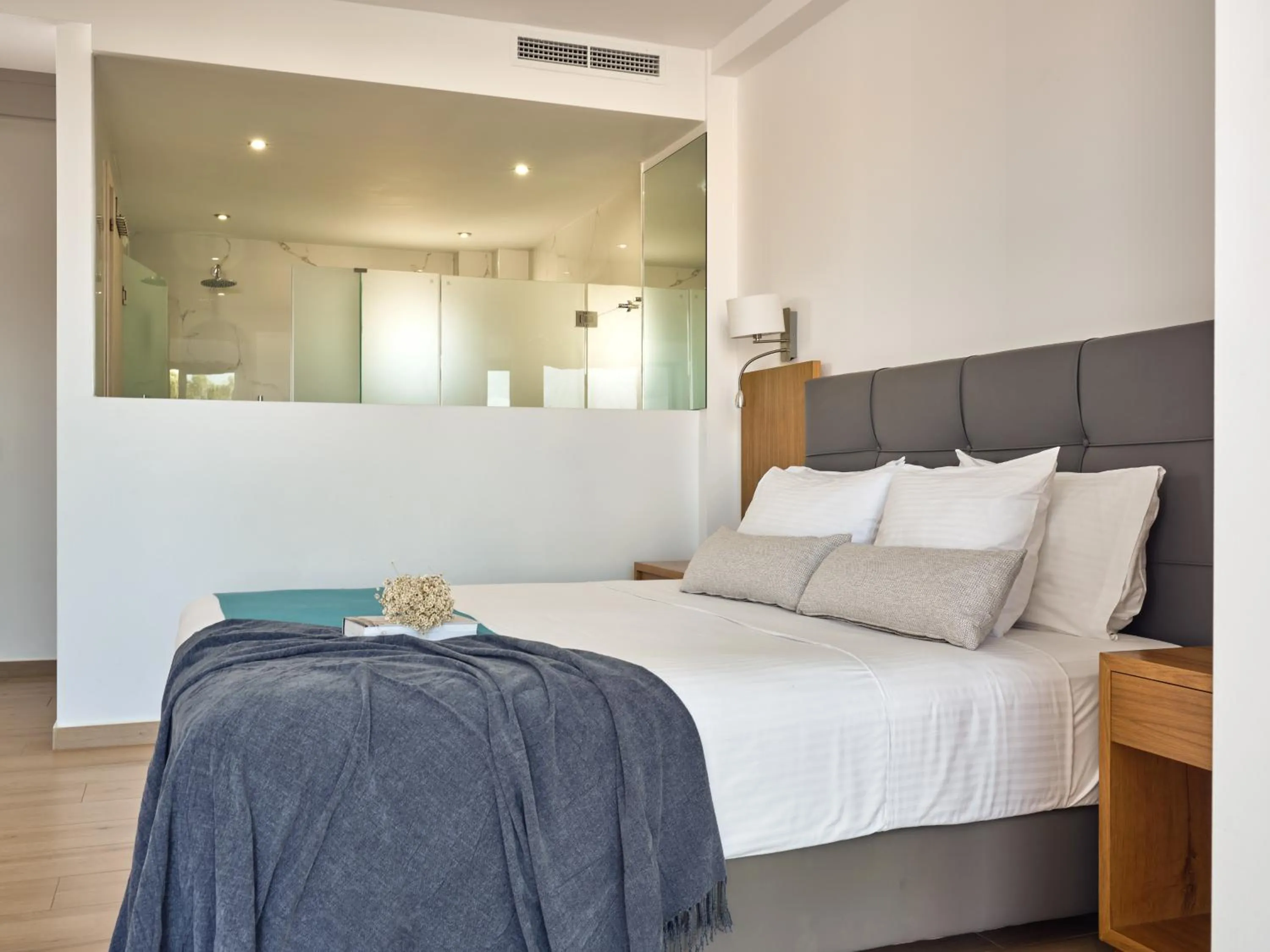 Bedroom, Bed in Cavo Orient Beach Hotel & Suites