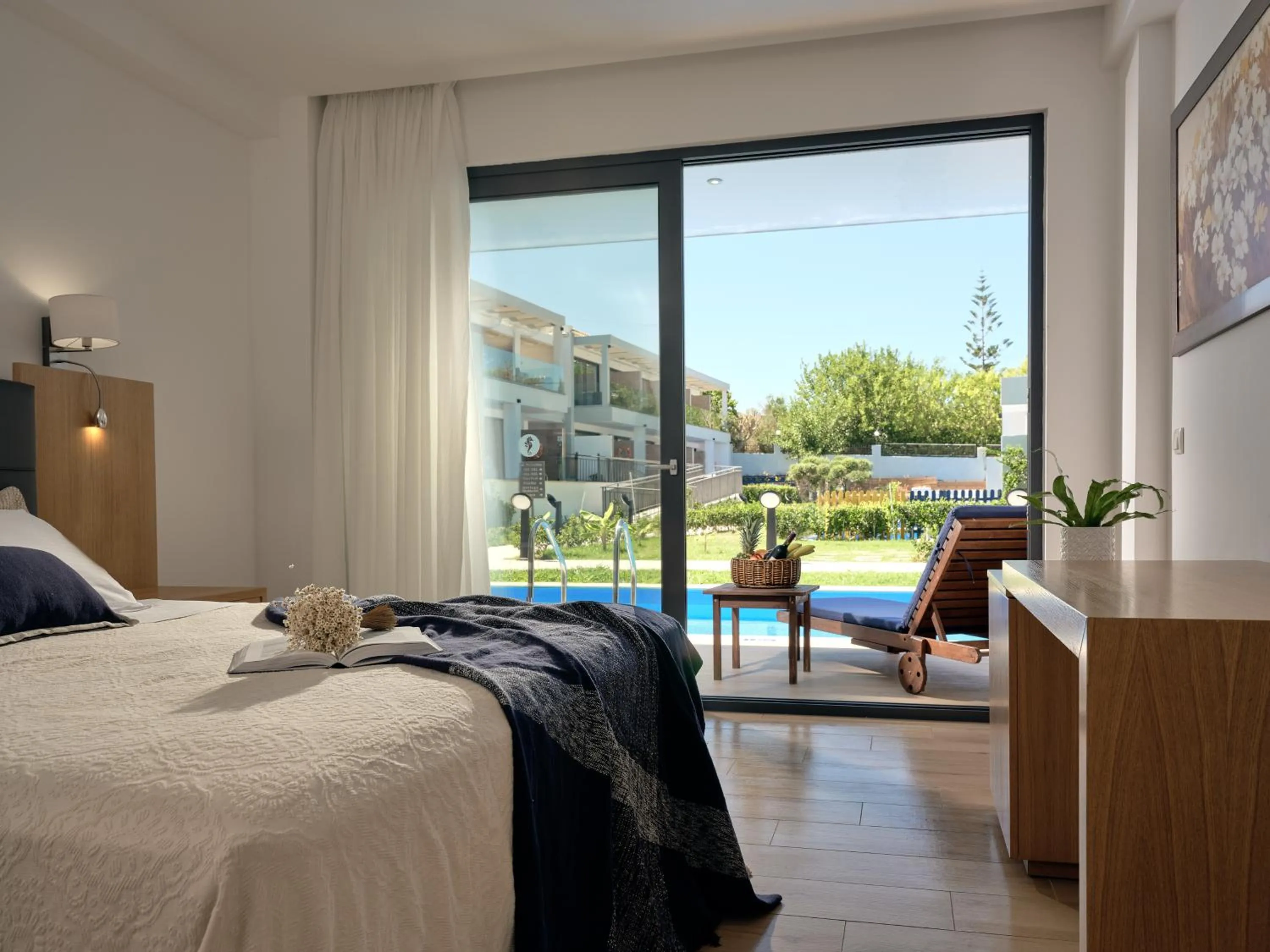 Pool view, Bed in Cavo Orient Beach Hotel & Suites