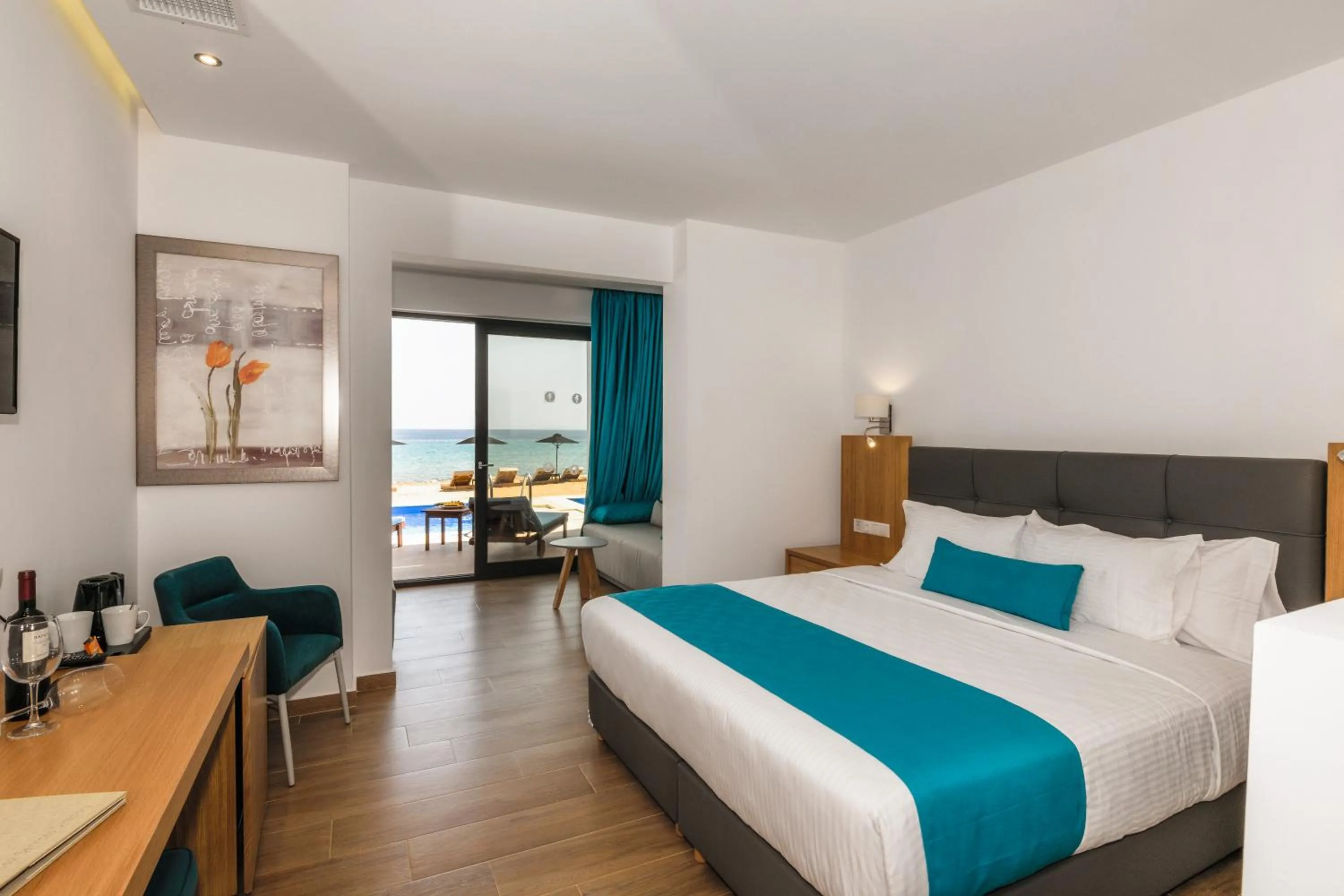 Photo of the whole room, Bed in Cavo Orient Beach Hotel & Suites