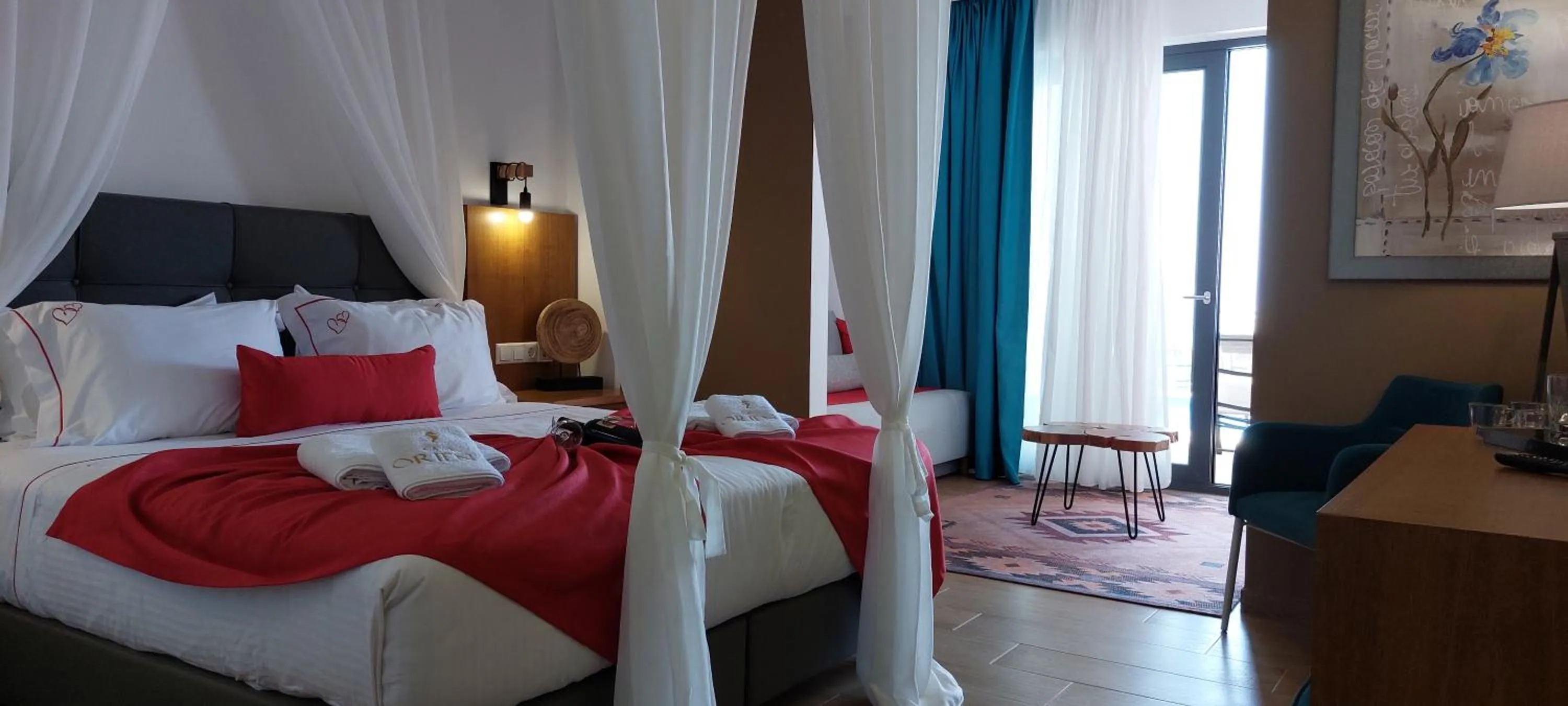 Bed in Cavo Orient Beach Hotel & Suites