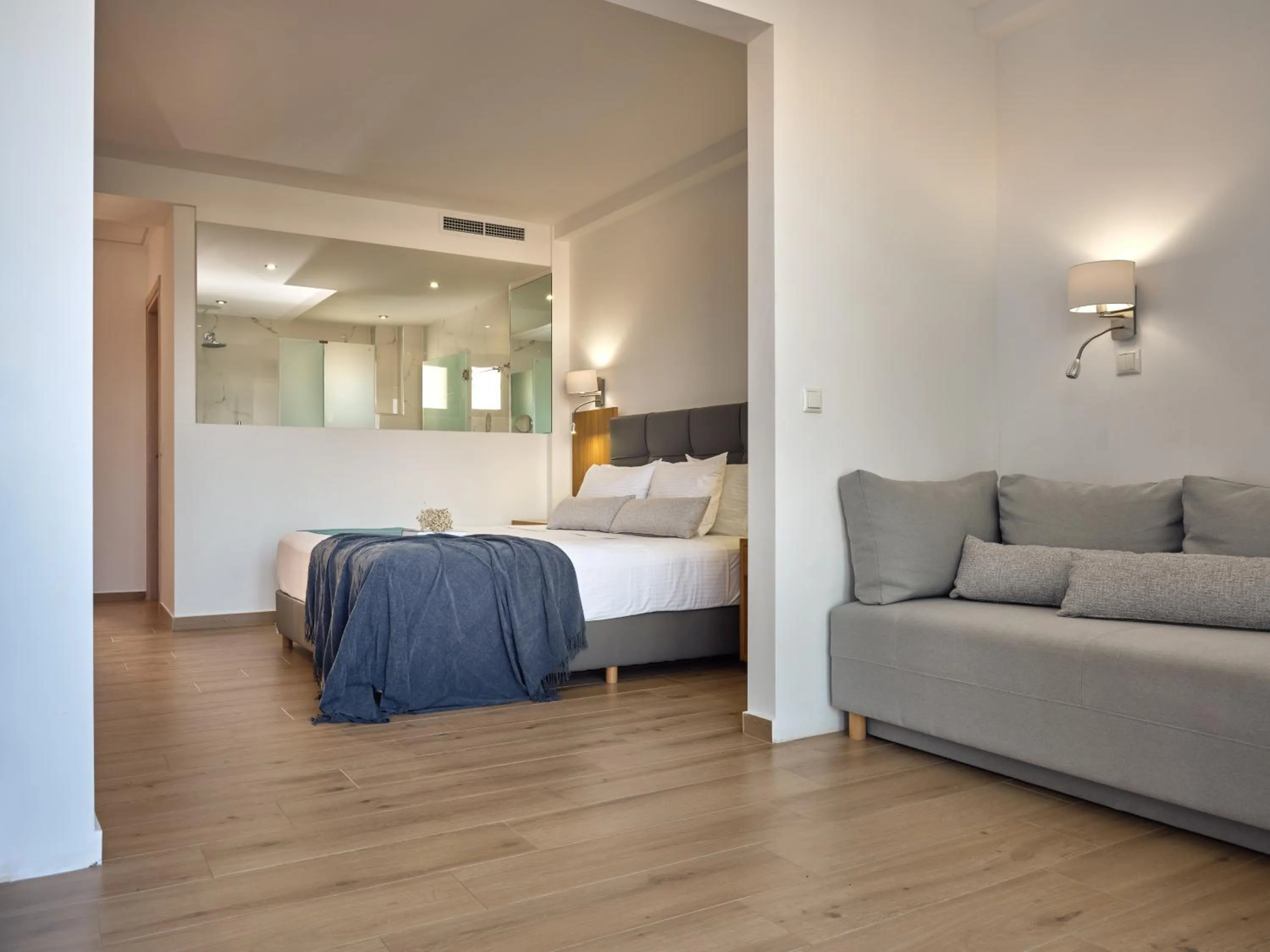 Photo of the whole room, Bed in Cavo Orient Beach Hotel & Suites