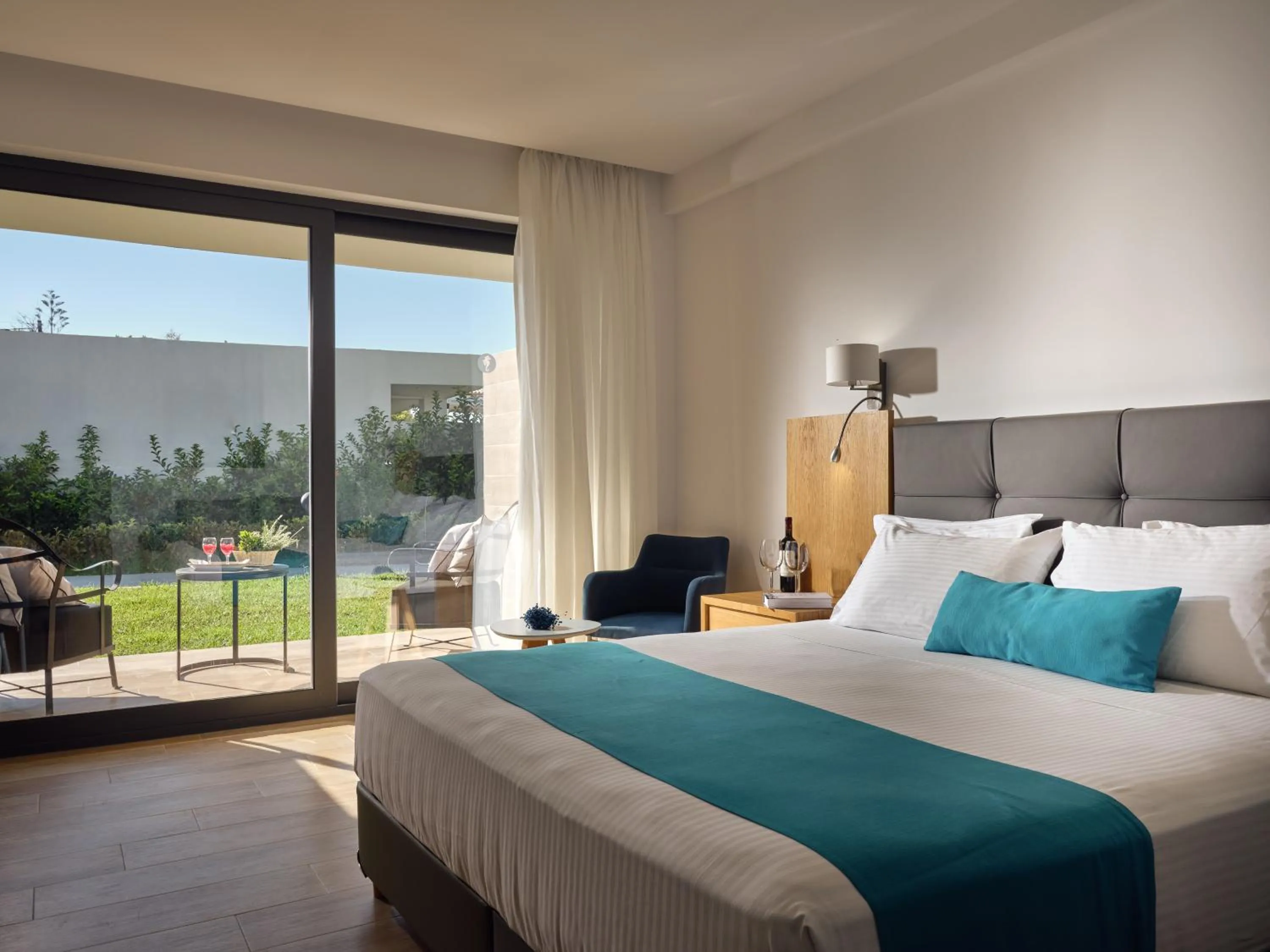 Bedroom, Bed in Cavo Orient Beach Hotel & Suites