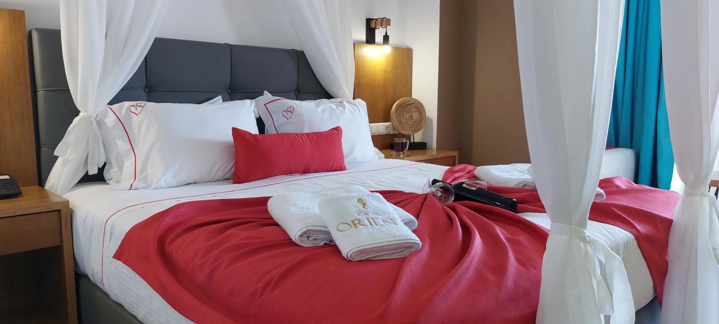 Bed in Cavo Orient Beach Hotel & Suites