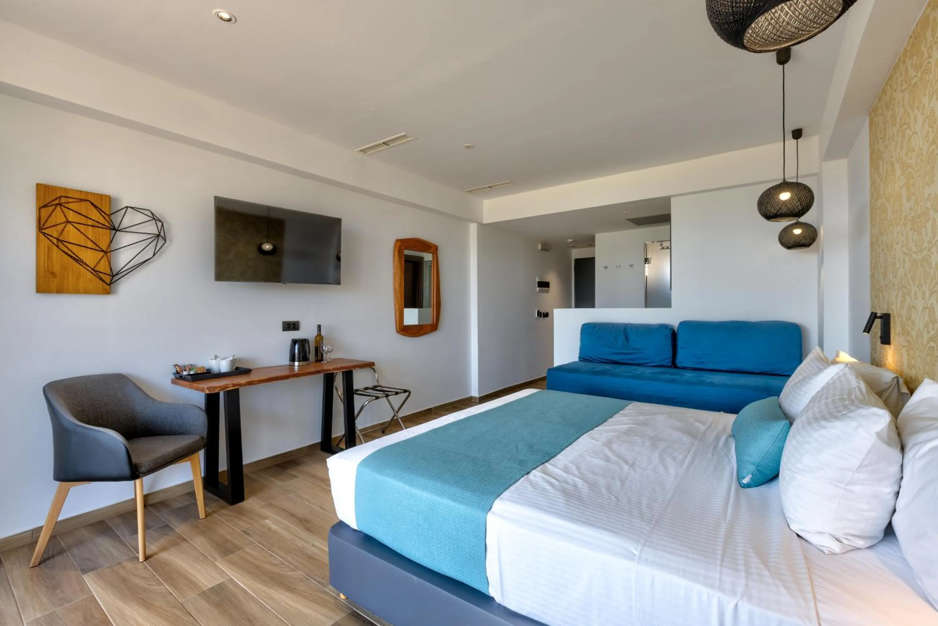 Bed in Cavo Orient Beach Hotel & Suites