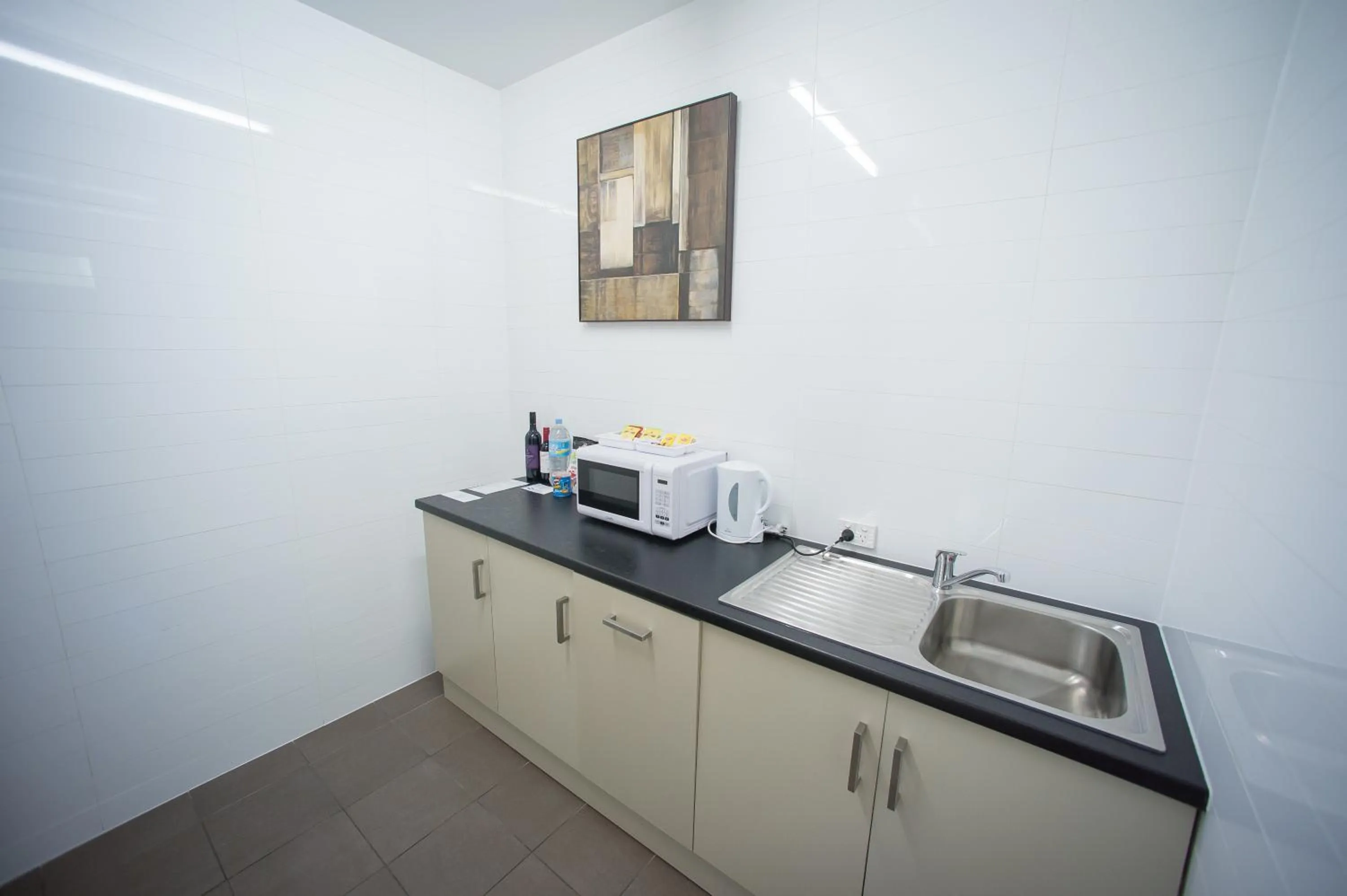 Kitchen or kitchenette in Sfera's Park Suites & Convention Centre