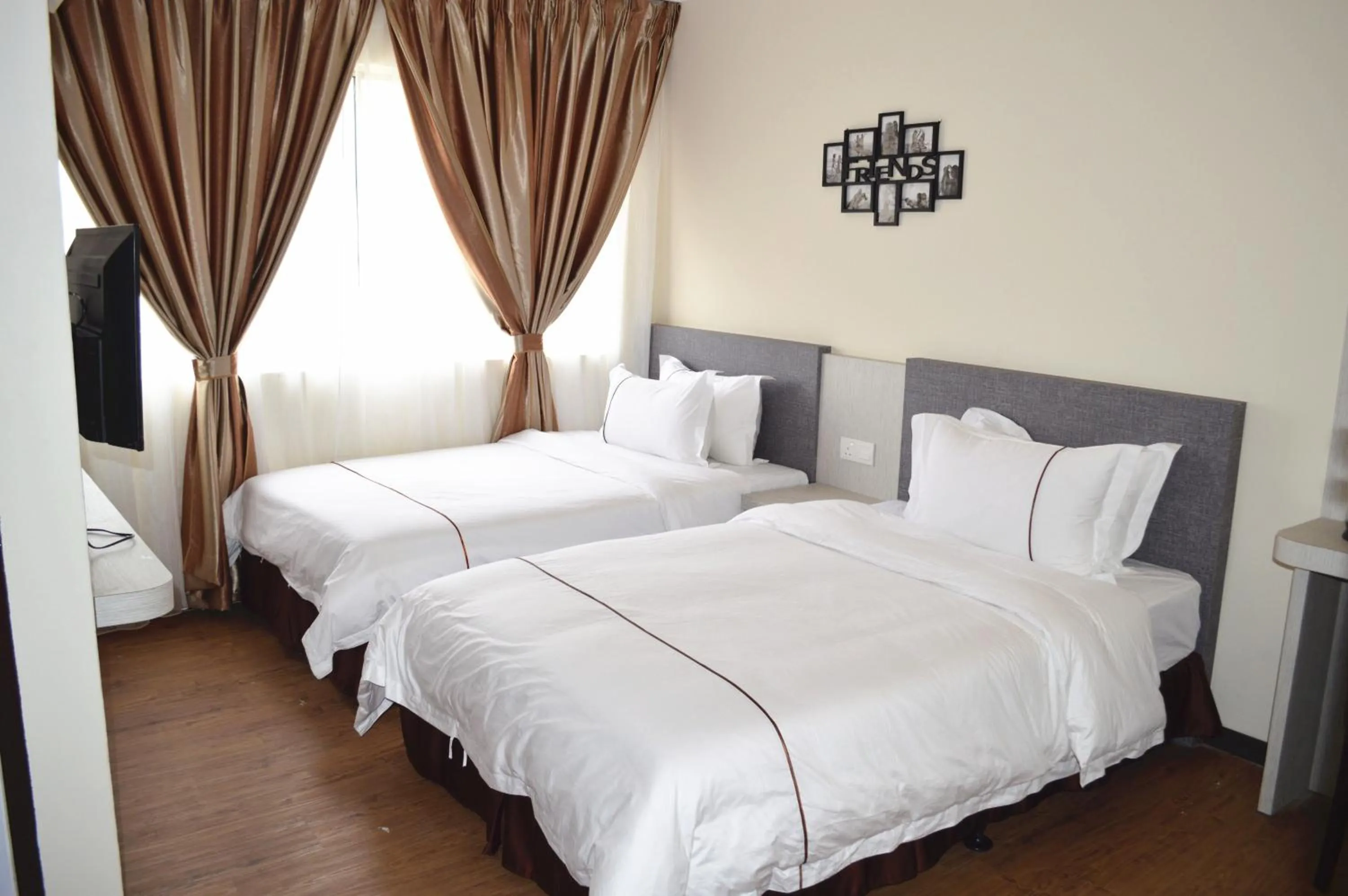 Bed in Angsoka Hotel