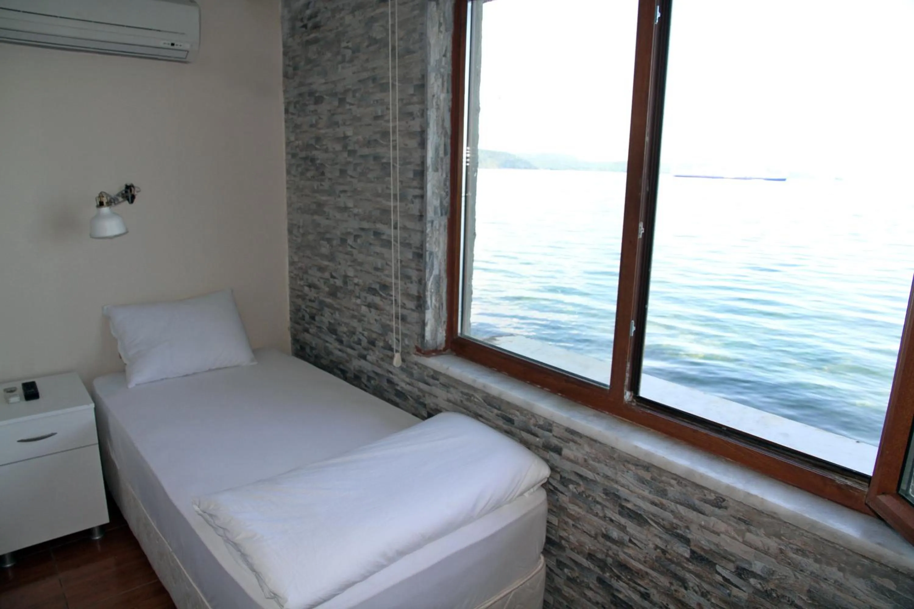 Photo of the whole room, Bed in Aqua Boss Hotel