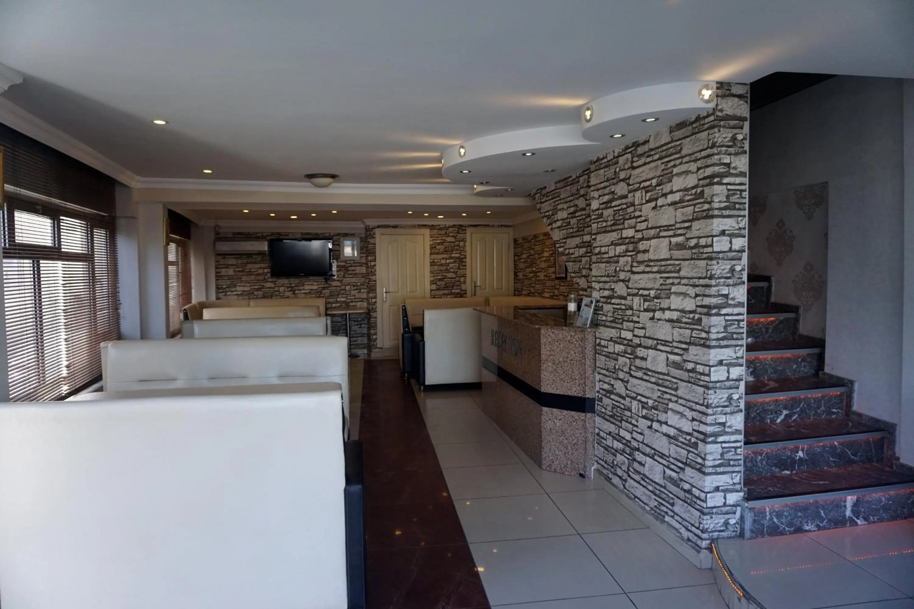 Communal lounge/ TV room in Boss Hotel