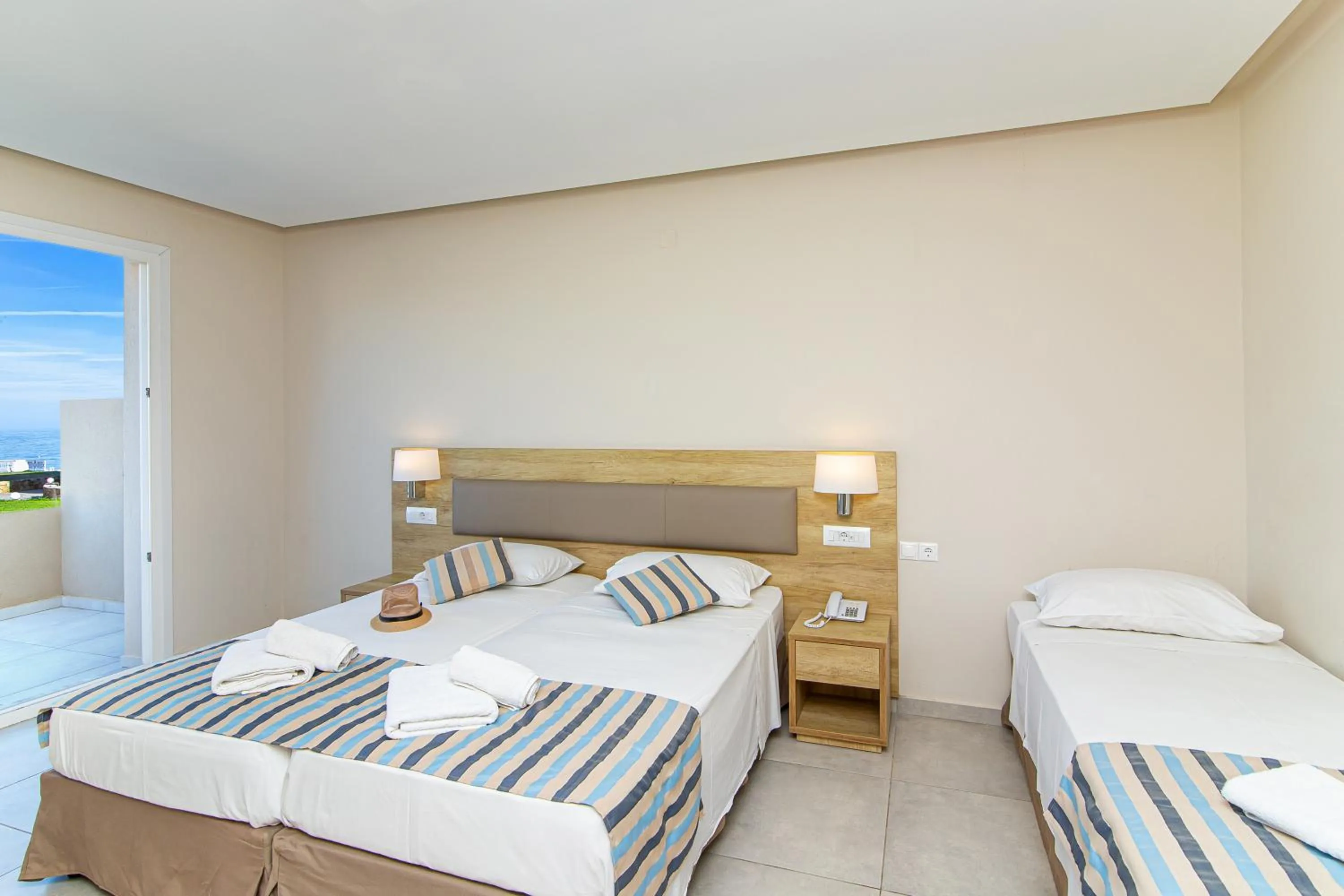 Bed in Theo Star Beach Hotel