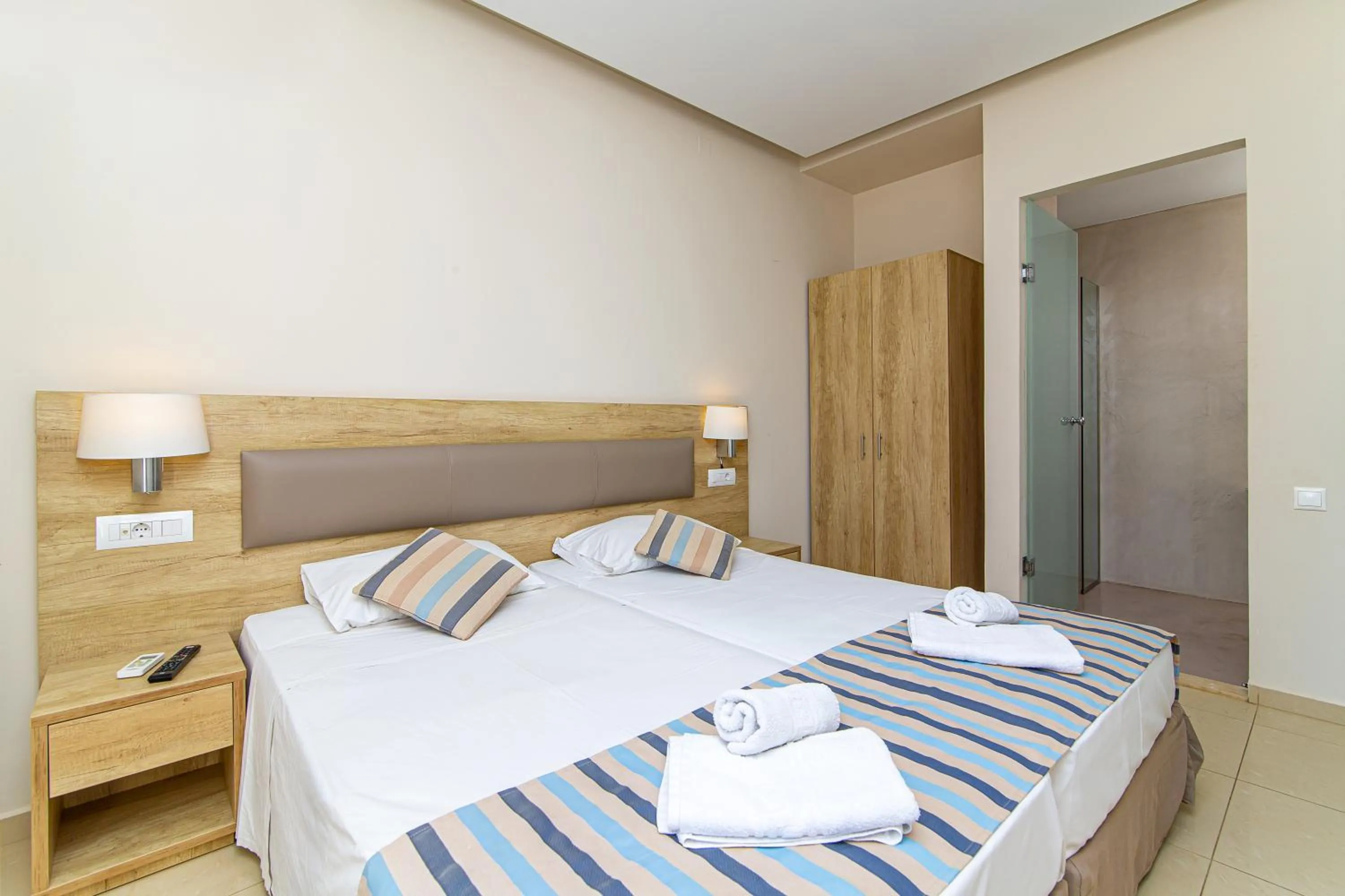 Bed in Theo Star Beach Hotel