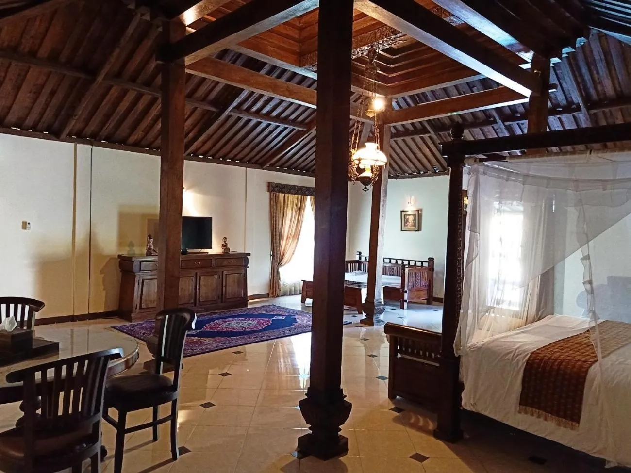 Bed in Joglo Plawang Villa & Resort